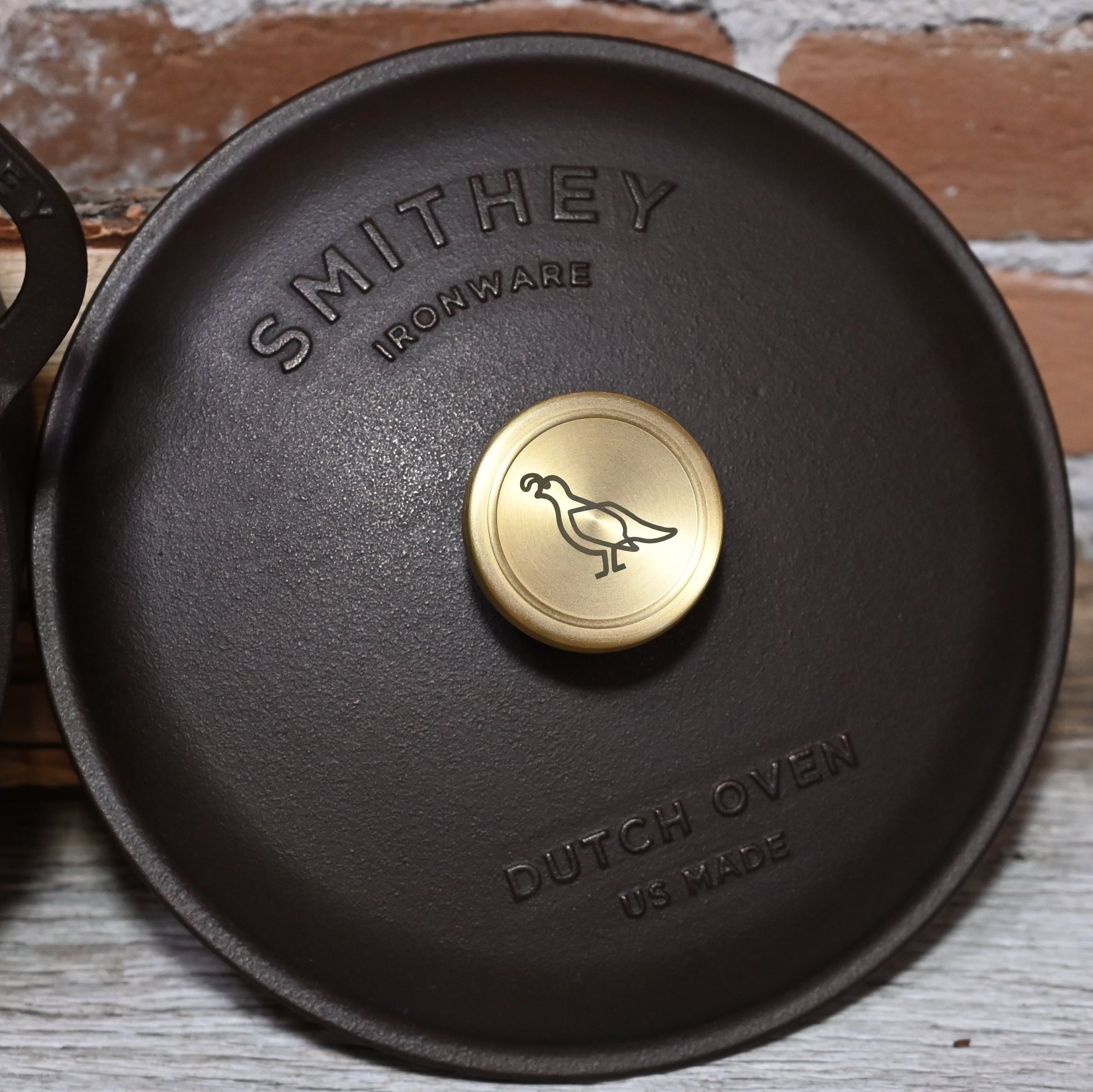View of Smithey 3.5 Qt Cast Iron Dutch Oven with polished interior and brass knob