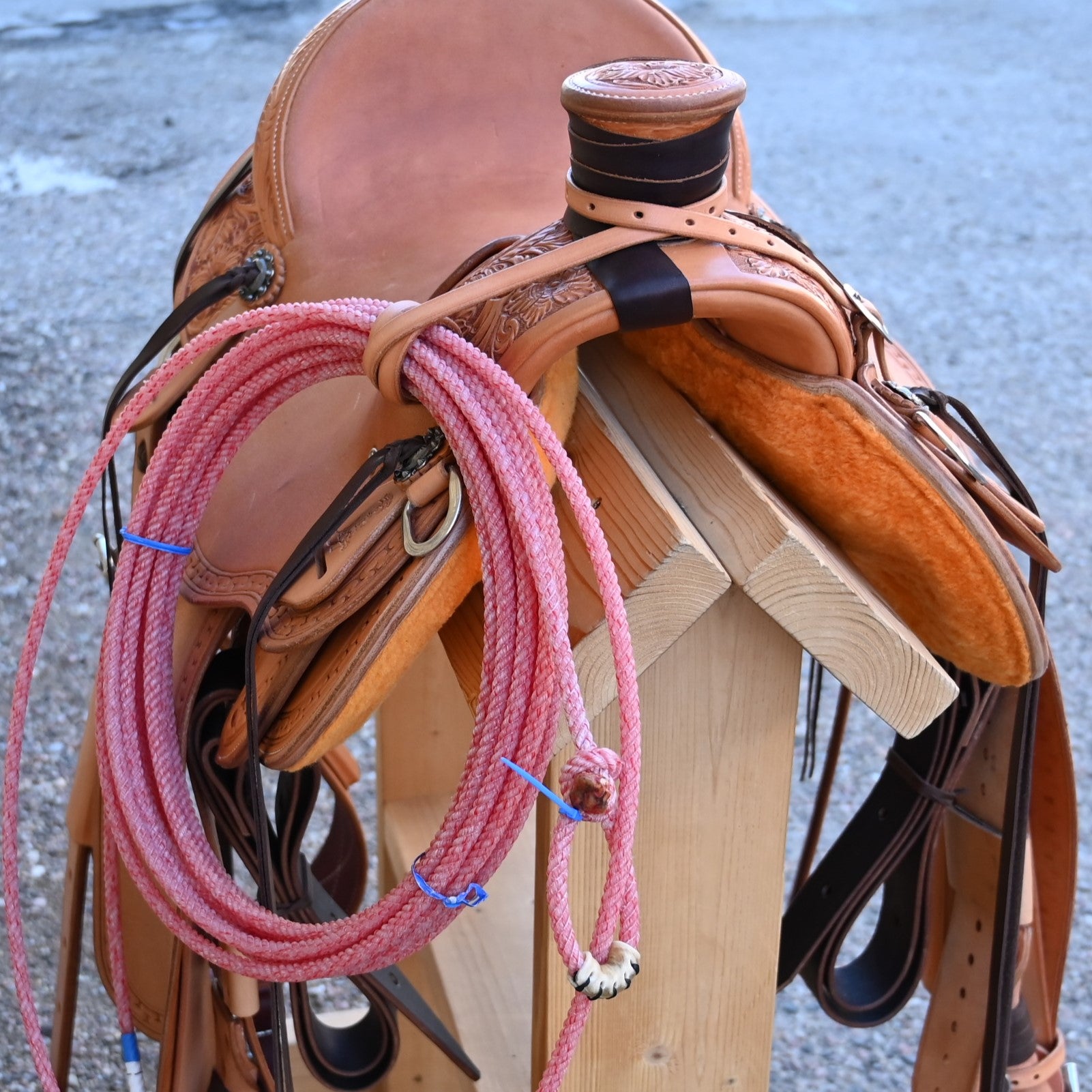 View of Deeter 3B Visalia Roughout Saddle with floral stamping and post horn