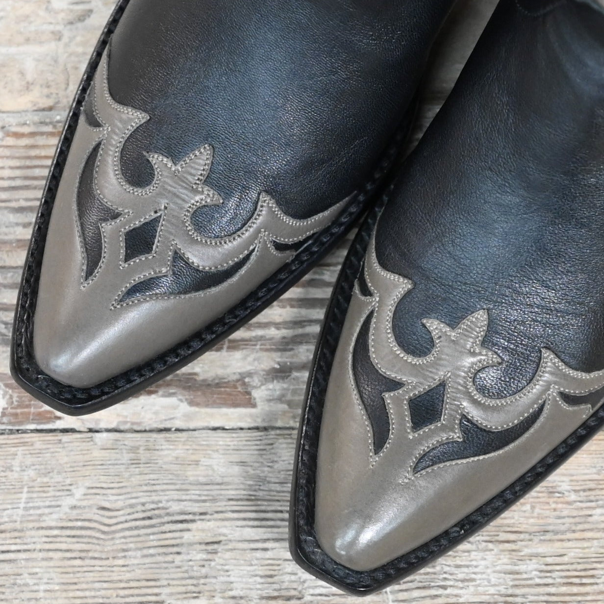 View of Stallion Ladies 11" midnight hair-on boot with gray wingtip, foxing, and multicolor inlays