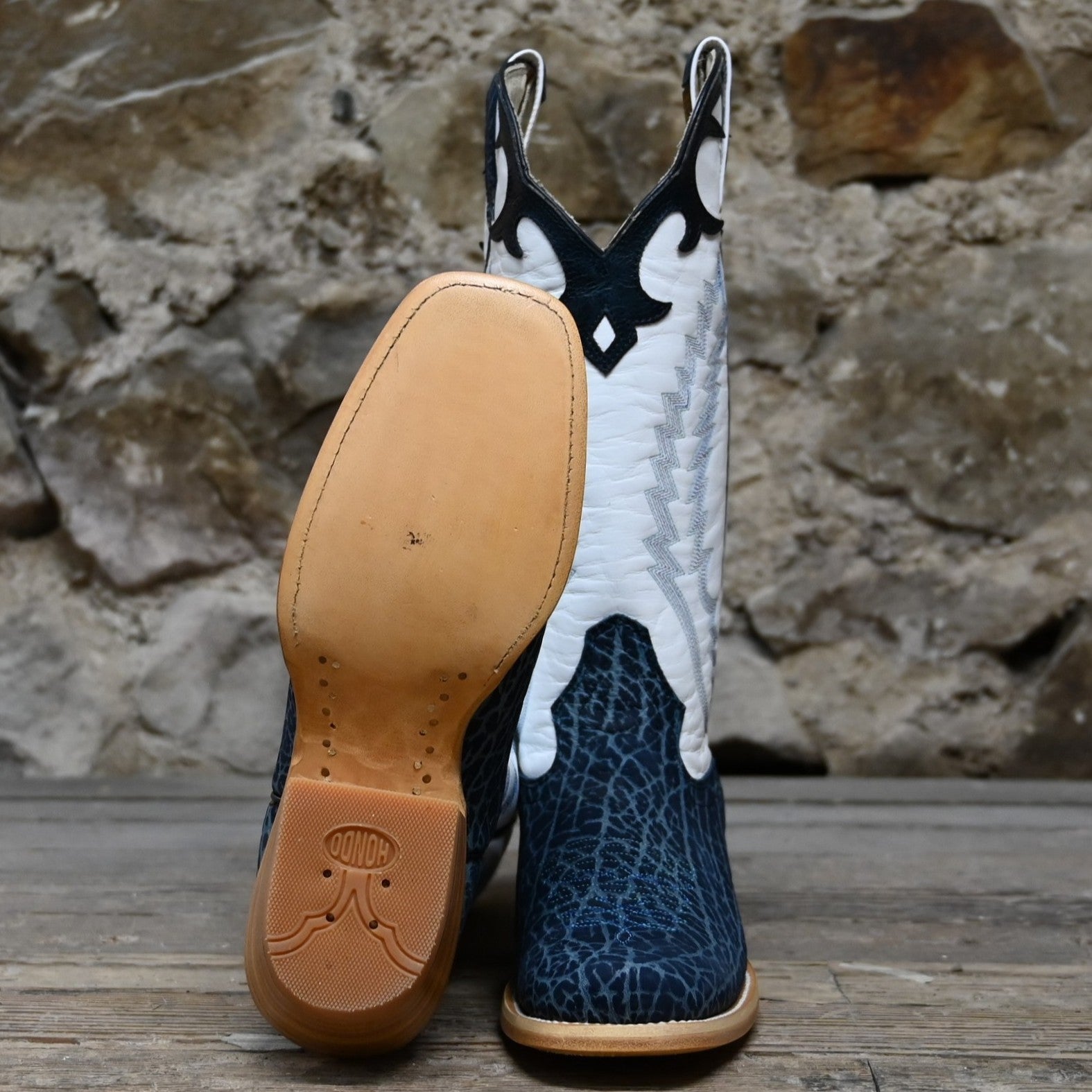 View of Hondo 13" cowboy boot with white top, navy nubuck bullhide vamp, blue stitching, snip toe, and spur ledge