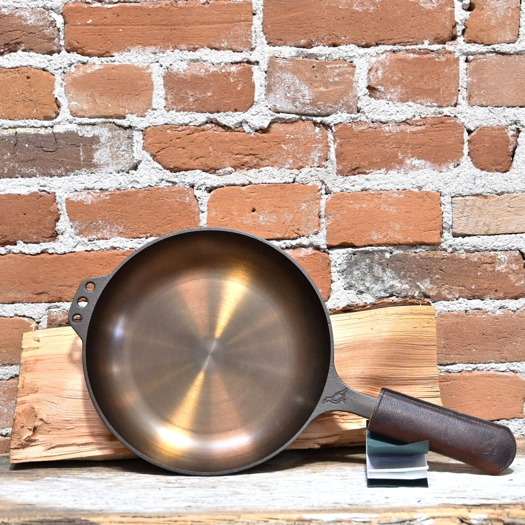 View of Smithey Ironware No. 10 Cast Iron Chef Skillet with polished interior and ergonomic handle