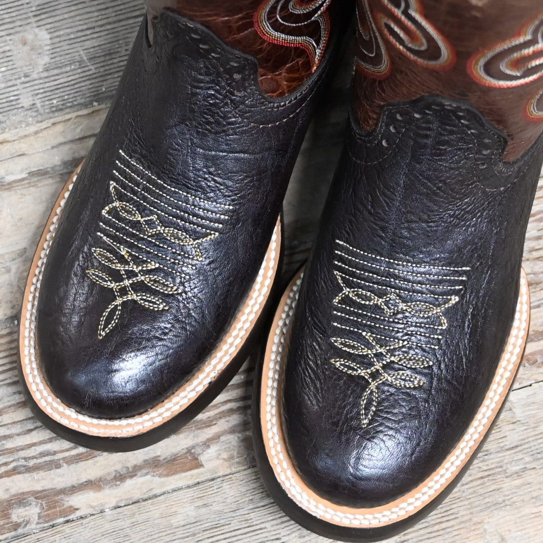 View of Hondo 13" cowboy boot with rust volcano top, chocolate Spanish shoulder vamp, and wide round toe