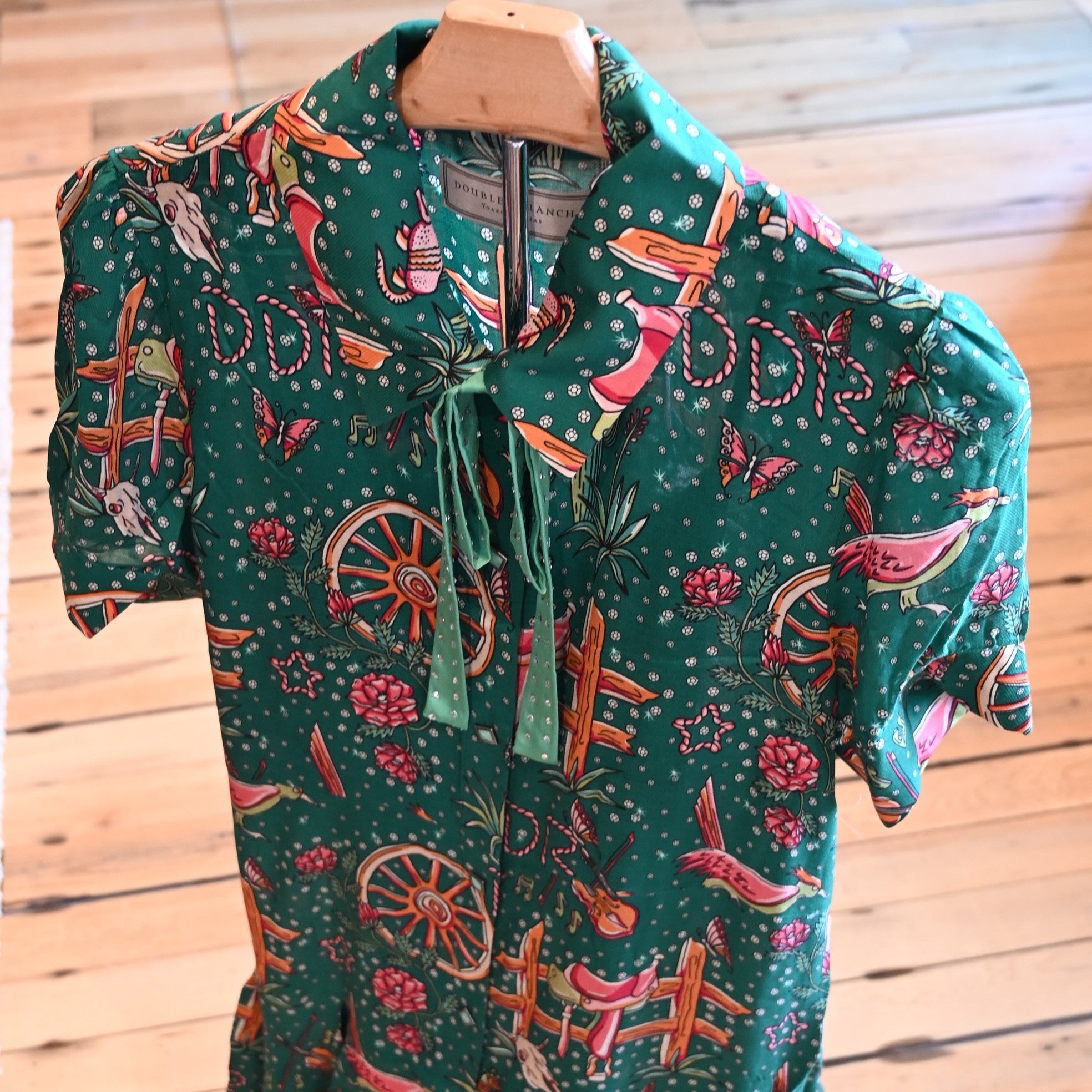 View of Double D Ranch Rhinestone Suits & Cowboy Boots Dress featuring custom Western print, faux-turquoise buttons, and pearl snaps in a relaxed fit