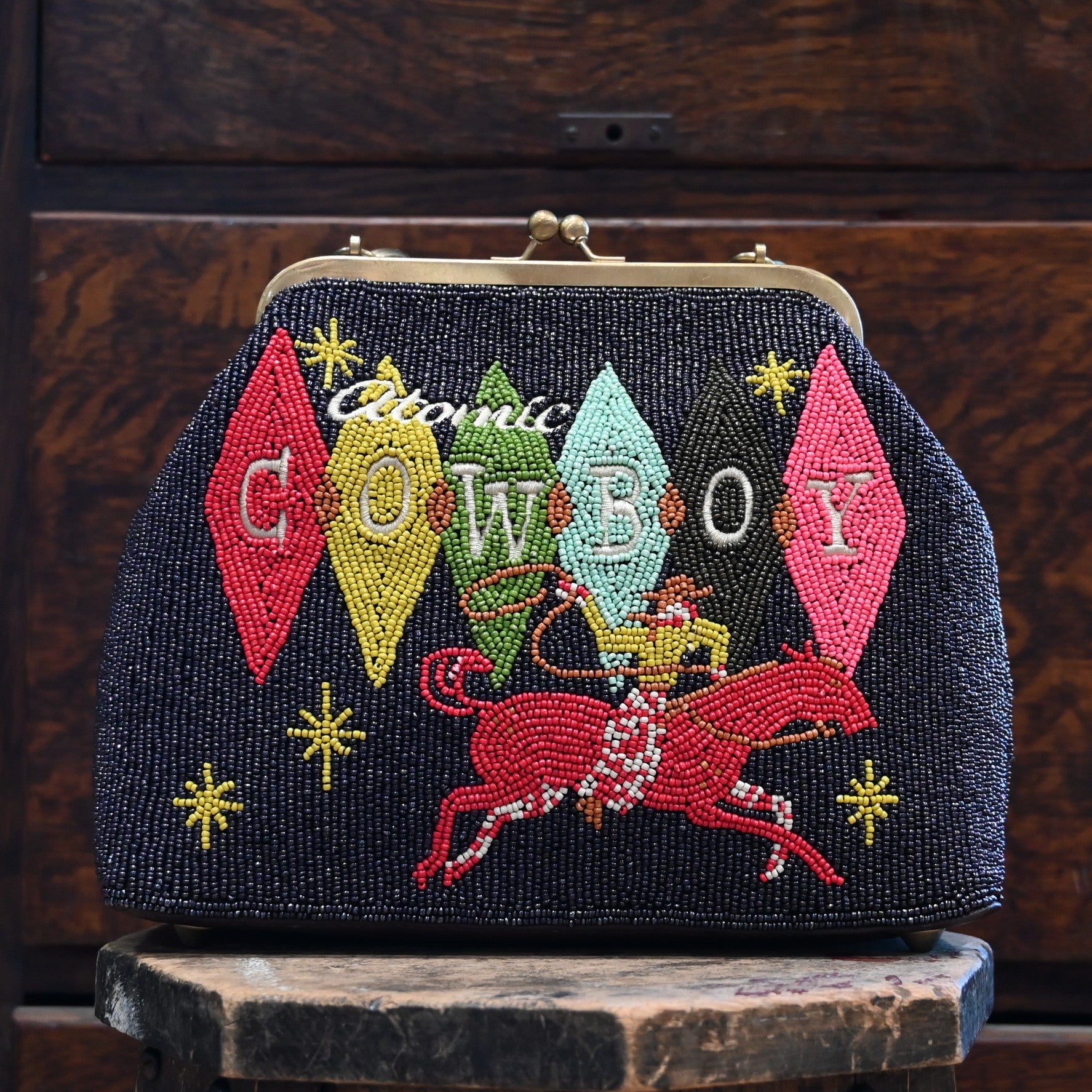 View of Beaded handbag in Atomic Ranch colors with tortoise shell lucite handle