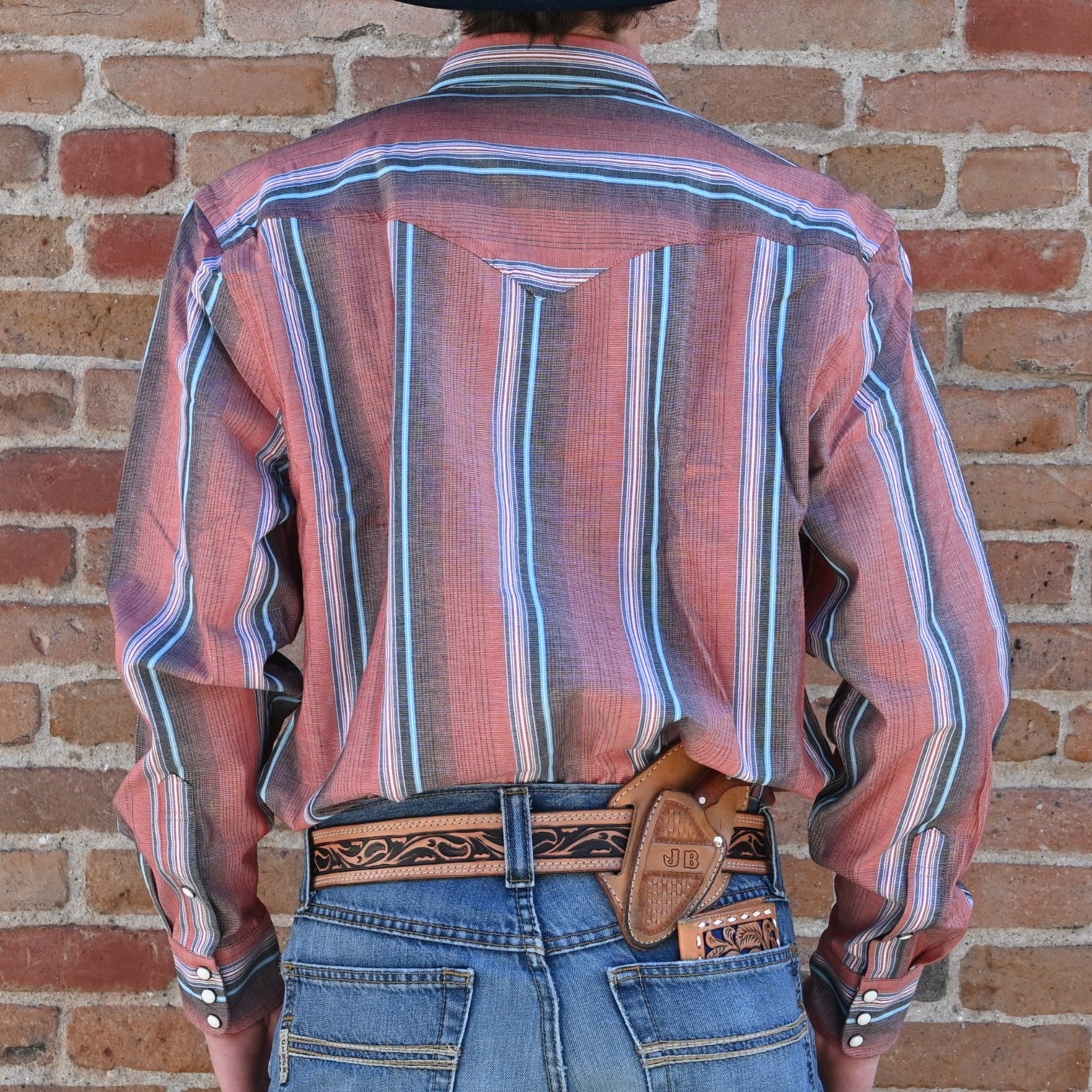 View of Schaefer Western snap shirt in assorted patterns with pearl snaps and vented back