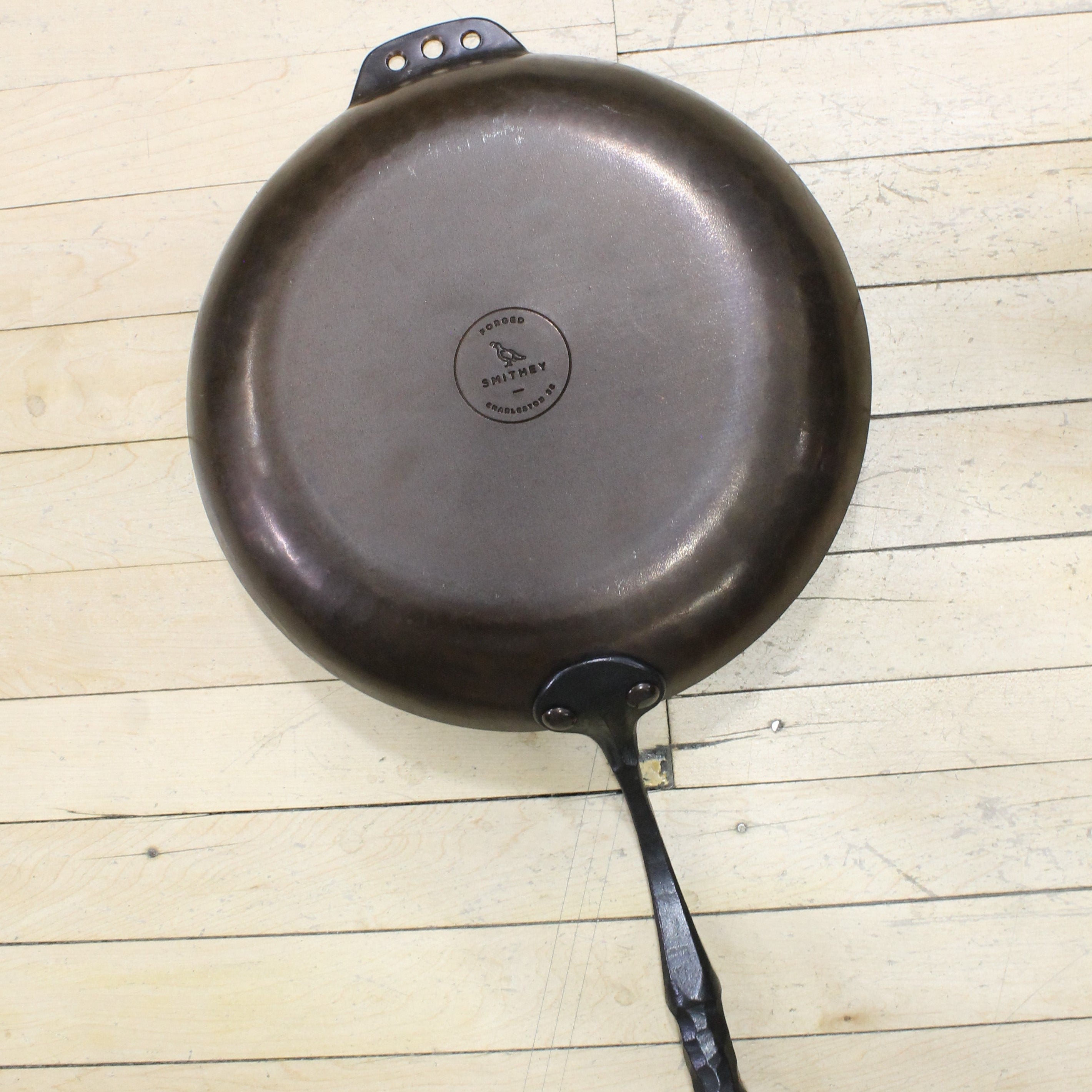 View of Smithey 12" Carbon Steel Farmhouse Skillet – Hand-forged pan with hammered handle and pre-seasoned interior
