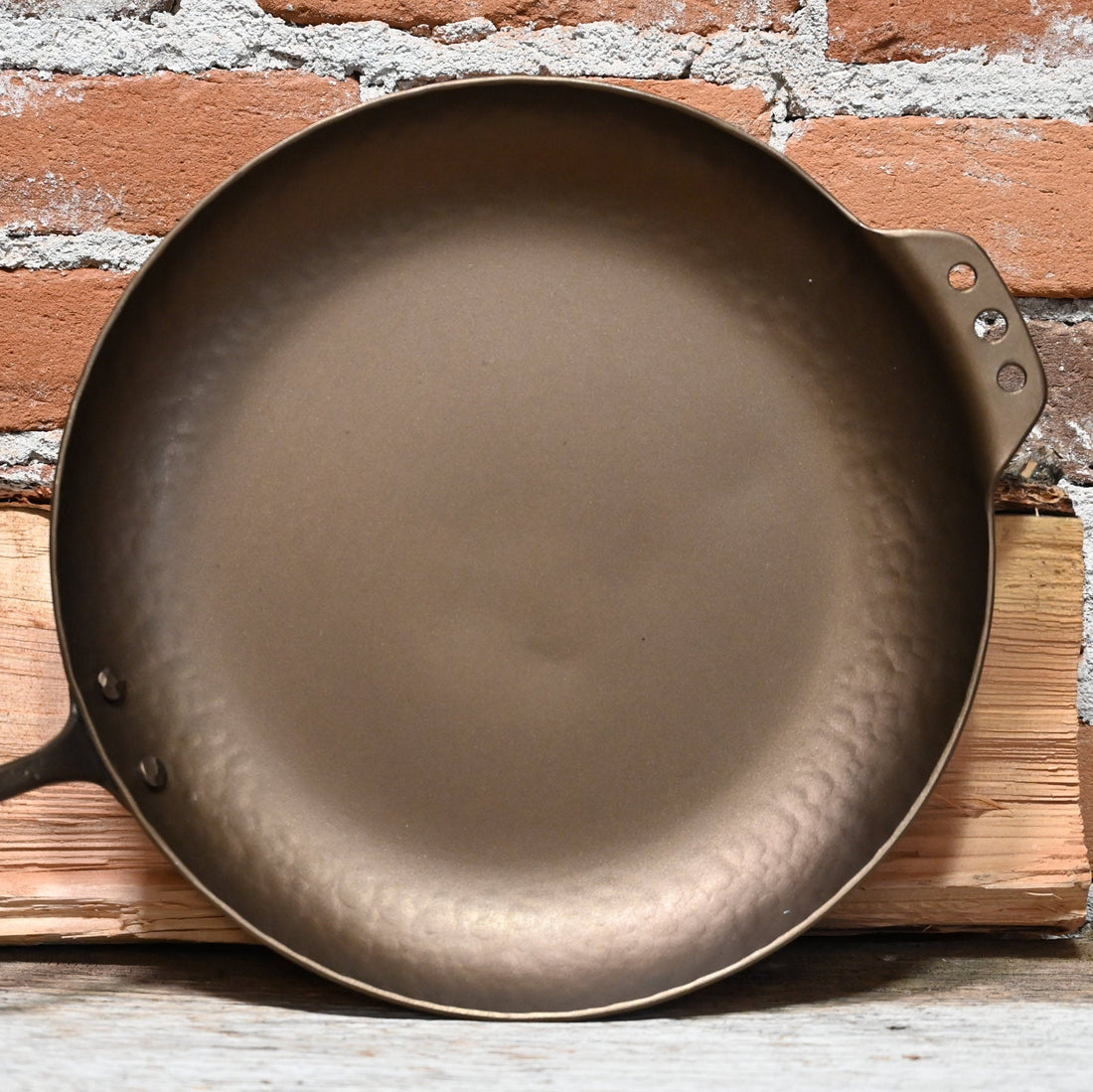 View of Smithey 12" Carbon Steel Farmhouse Skillet – Hand-forged pan with hammered handle and pre-seasoned interior