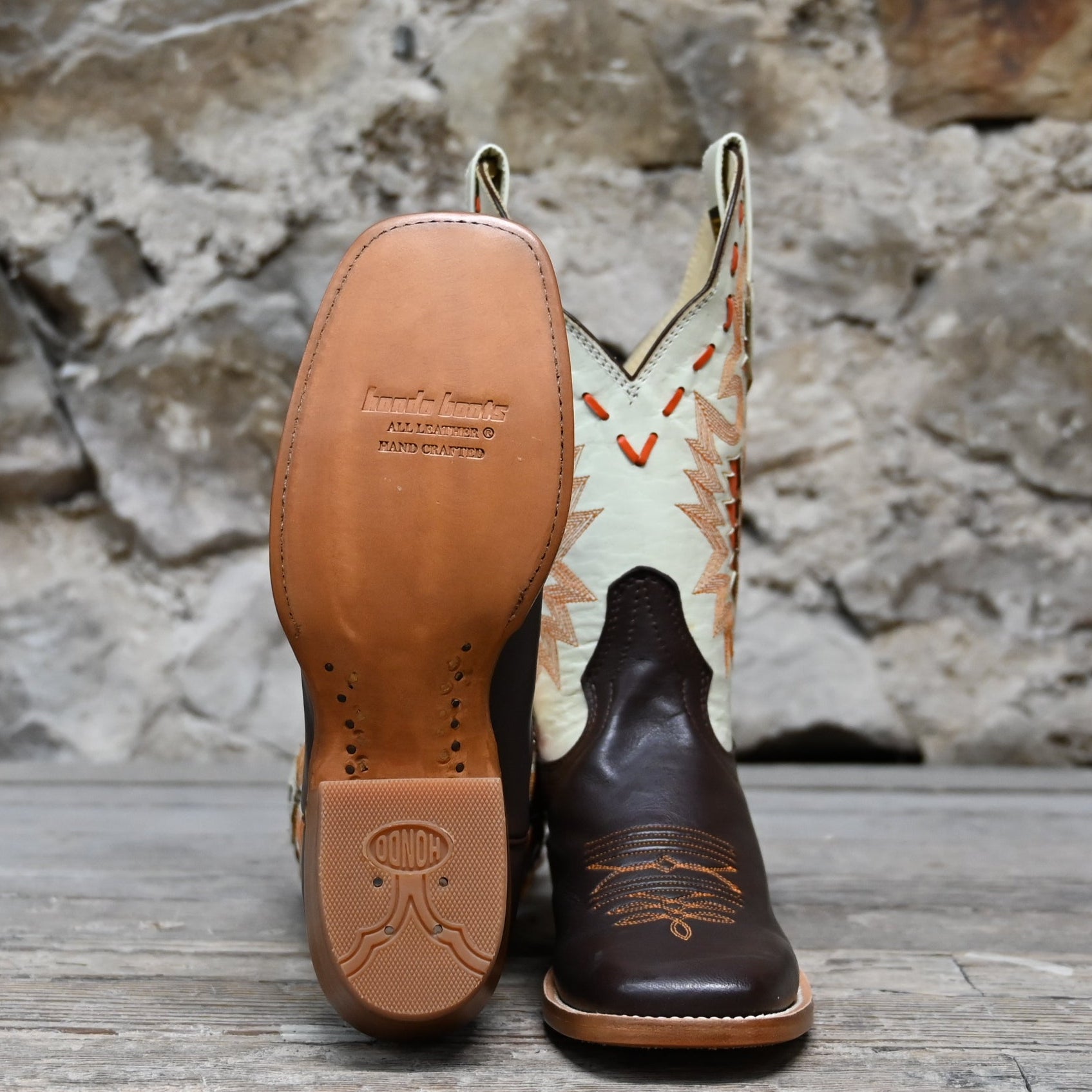View of Hondo 11" cowboy boot with bone top, brown calf vamp, wide square toe, and pull straps