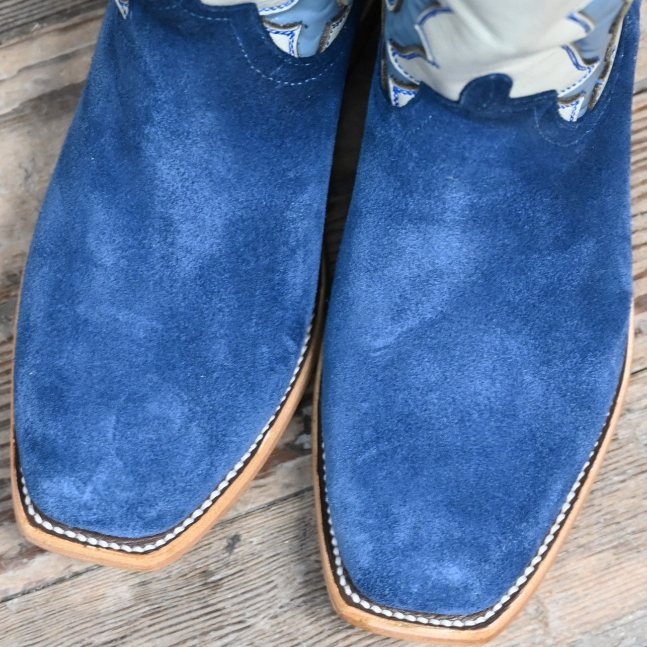 View of Macie Bean Top Hand 13″ boot with blue suede vamp and cream Mercedes-stitched top