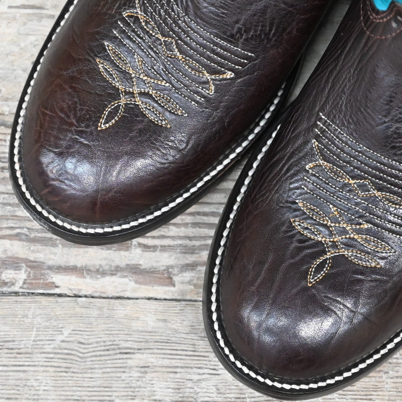 View of Hondo 13" cowboy boot with turquoise top, brown shoulder vamp, wide round toe, and spur ledge