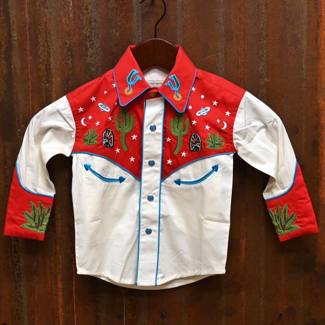 View of Red and ivory youth Western shirt with cactus and star embroidery and snap details