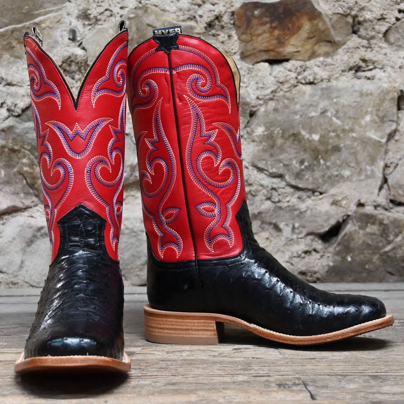 View of Hyer JETMORE 13" boots showcasing black full-quill ostrich vamp and red vintage goat upper with broad square toe and Stockman block heel