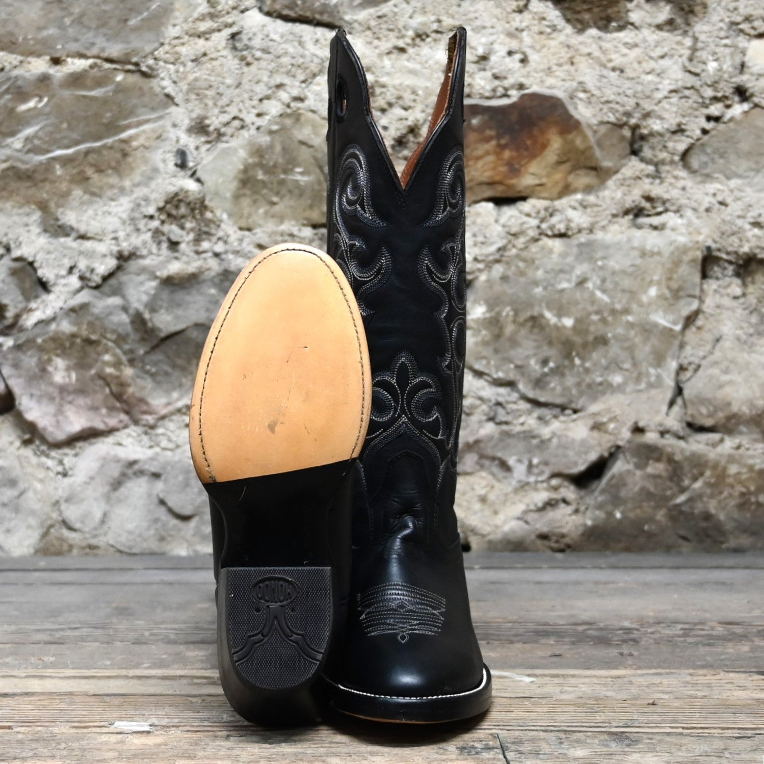 View of Hondo 16" cowboy boot with black retan vamp, natural lined top, flourished stitching, and spur ledge
