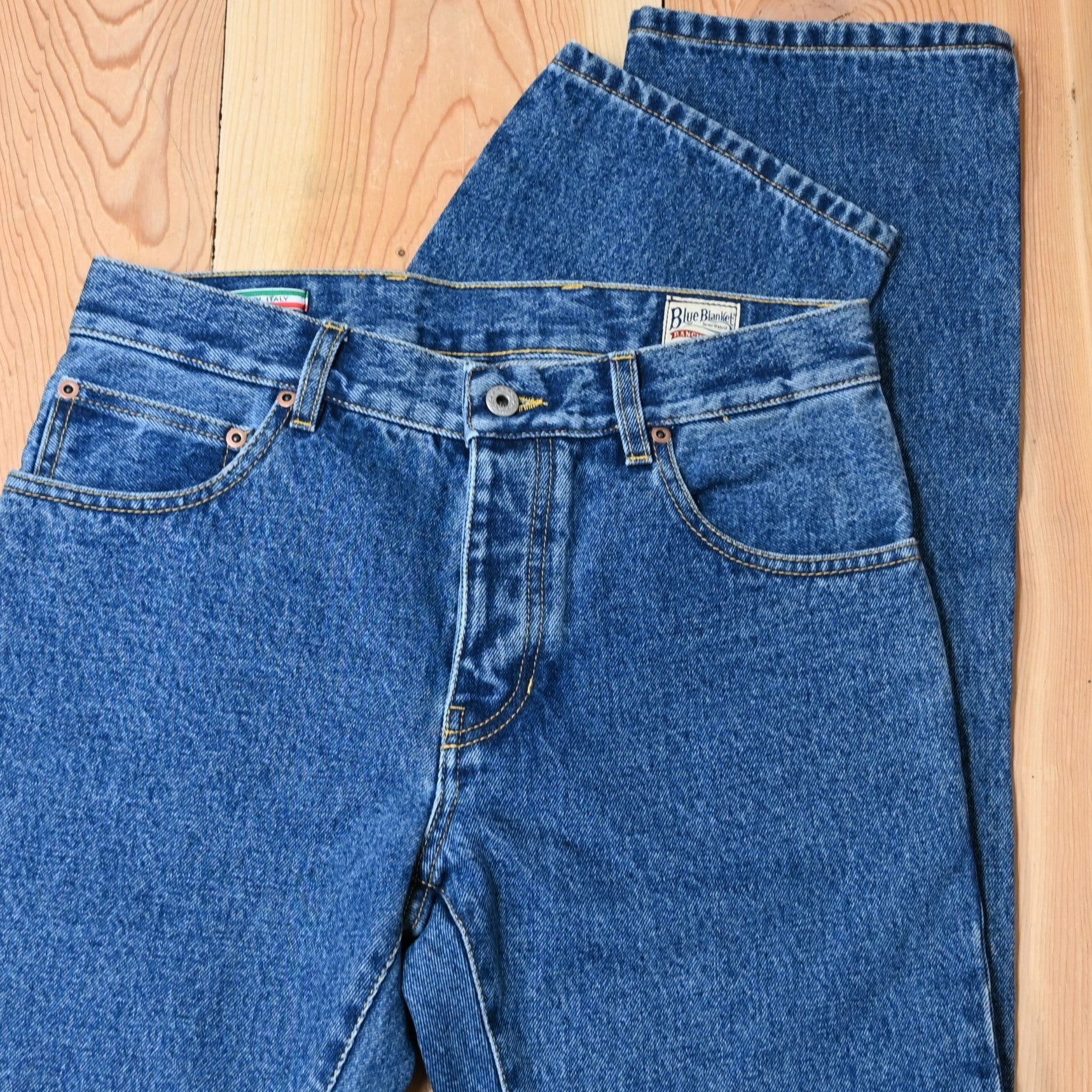 View of Blue Blanket men’s medium indigo straight-leg denim jeans with leather patch