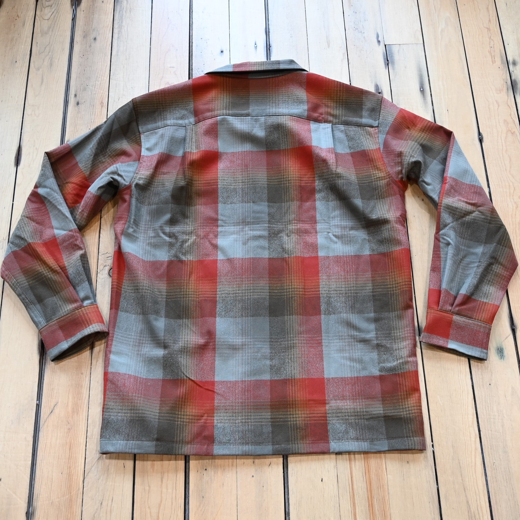 View of Pendleton men’s wool board shirt in tan red plaid with square hem and bias chest pockets