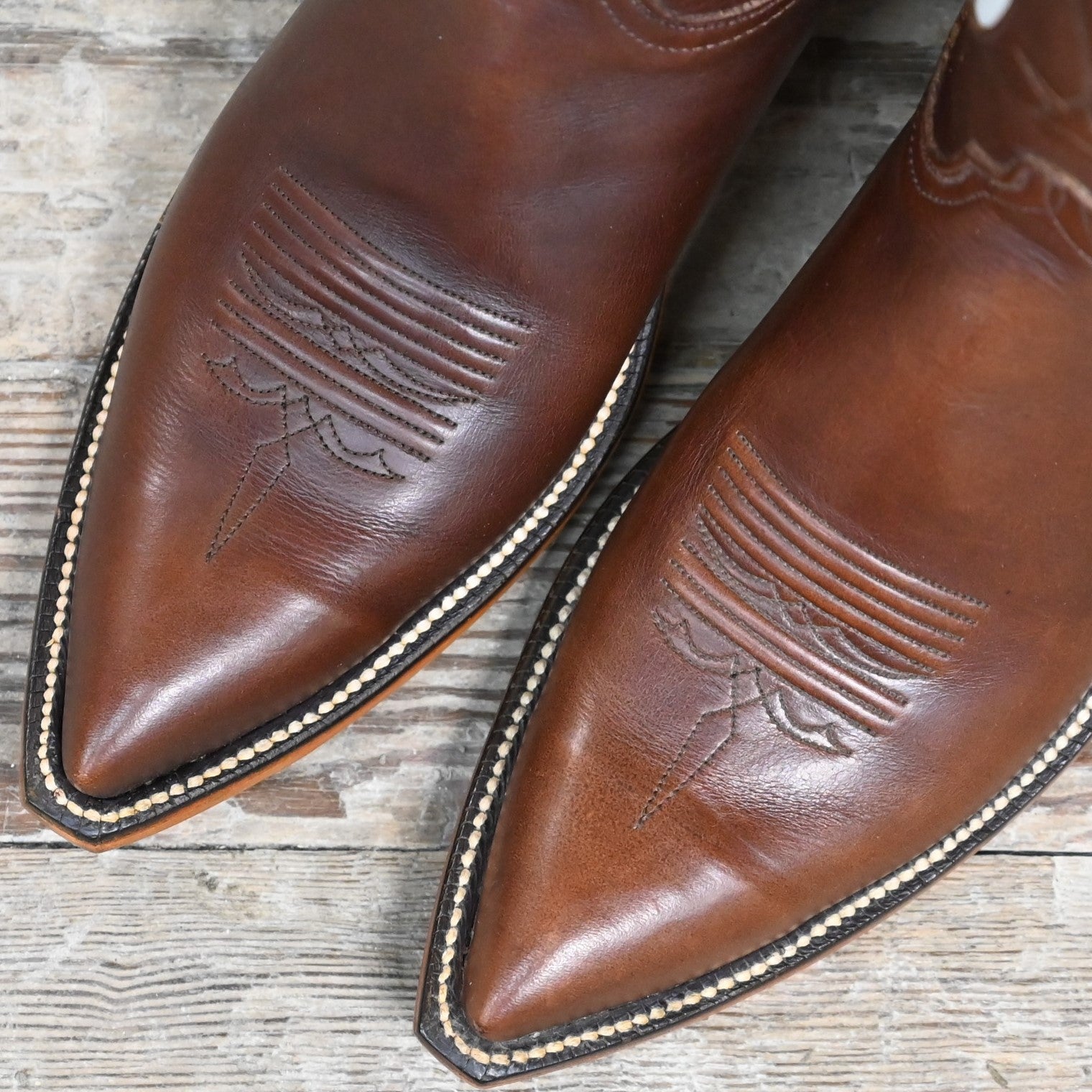 View of Lucchese ladies 12″ honey leather boot with star inlay and pointed square toe