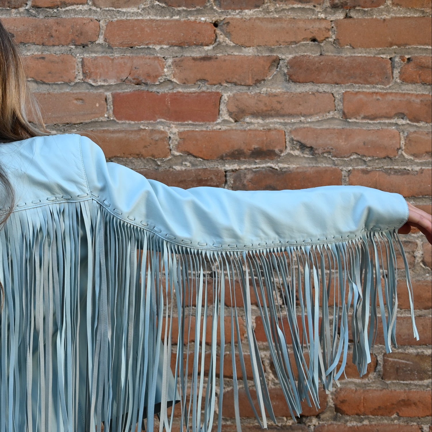 View of Double D Ranch Sonora Fringe Jacket – Celestial Sky sheepskin jacket with tonal fringe detailing and a slim, straight fit