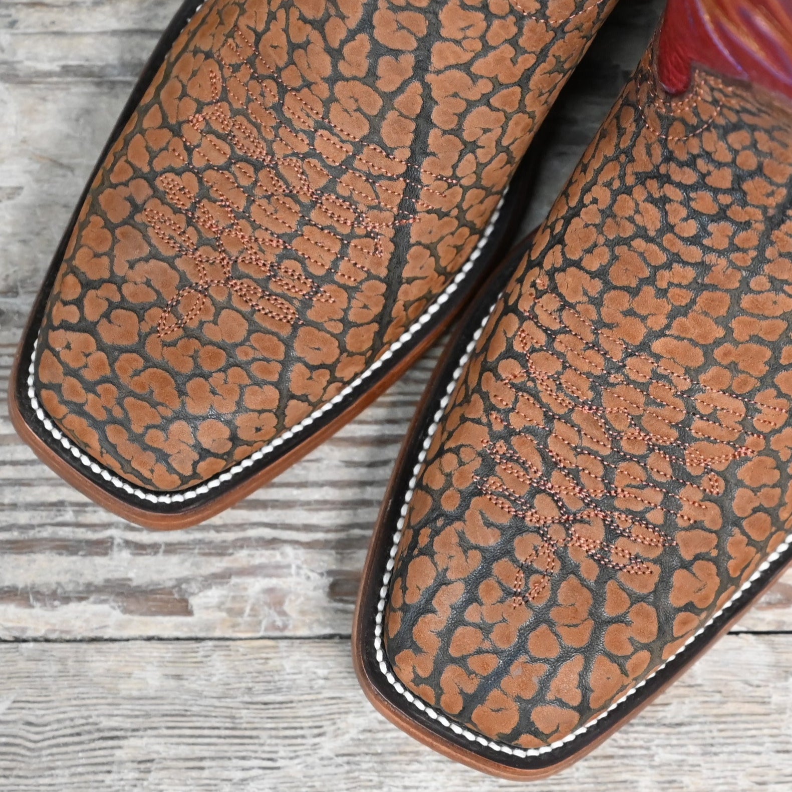 View of Hondo 13" cowboy boot with red volcano top, sand nubuck bullhide vamp, and medium square toe