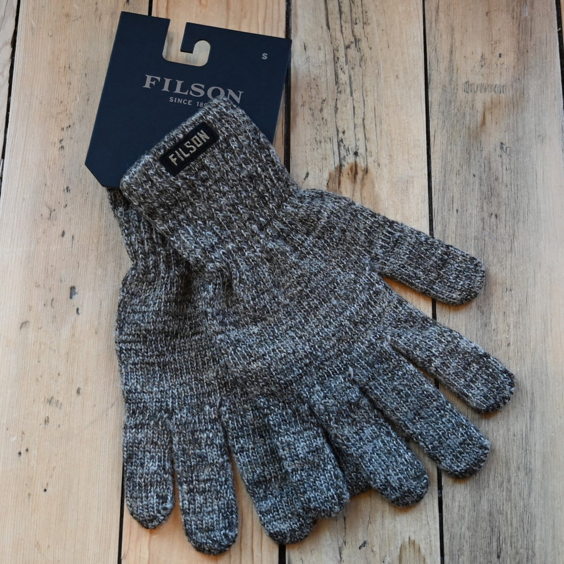 View of Filson Full Finger Knit Gloves featuring ragg-wool knit and rib-knit cuffs with Filson patch