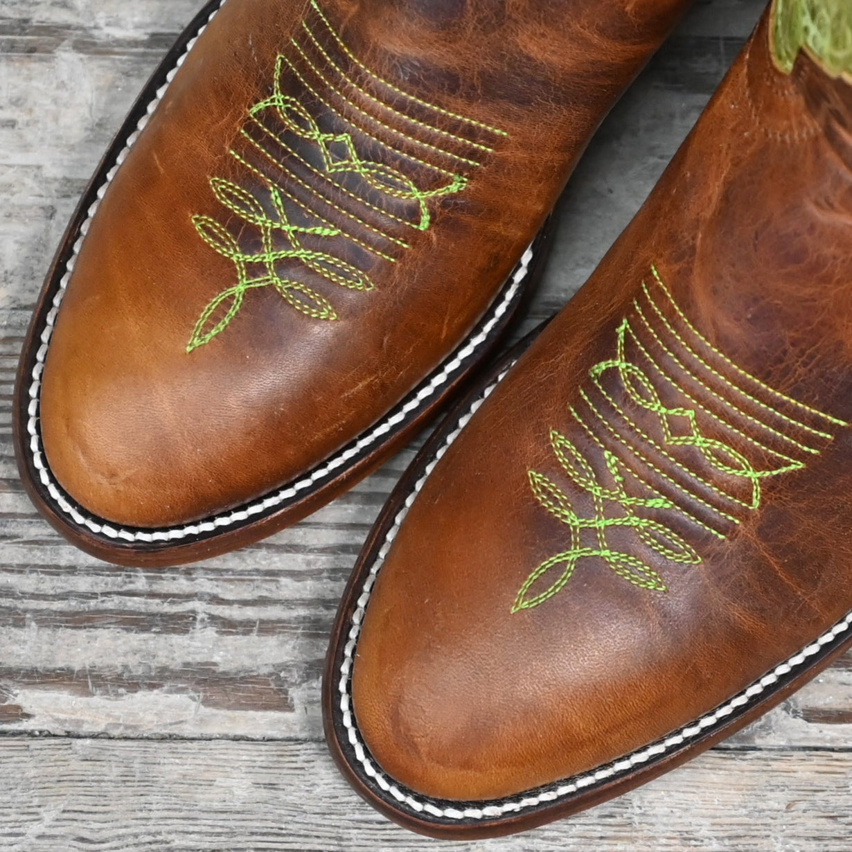 View of Hondo 16" cowboy boot with lime crater top, tan waxy vamp, pull holes, and spur ledge