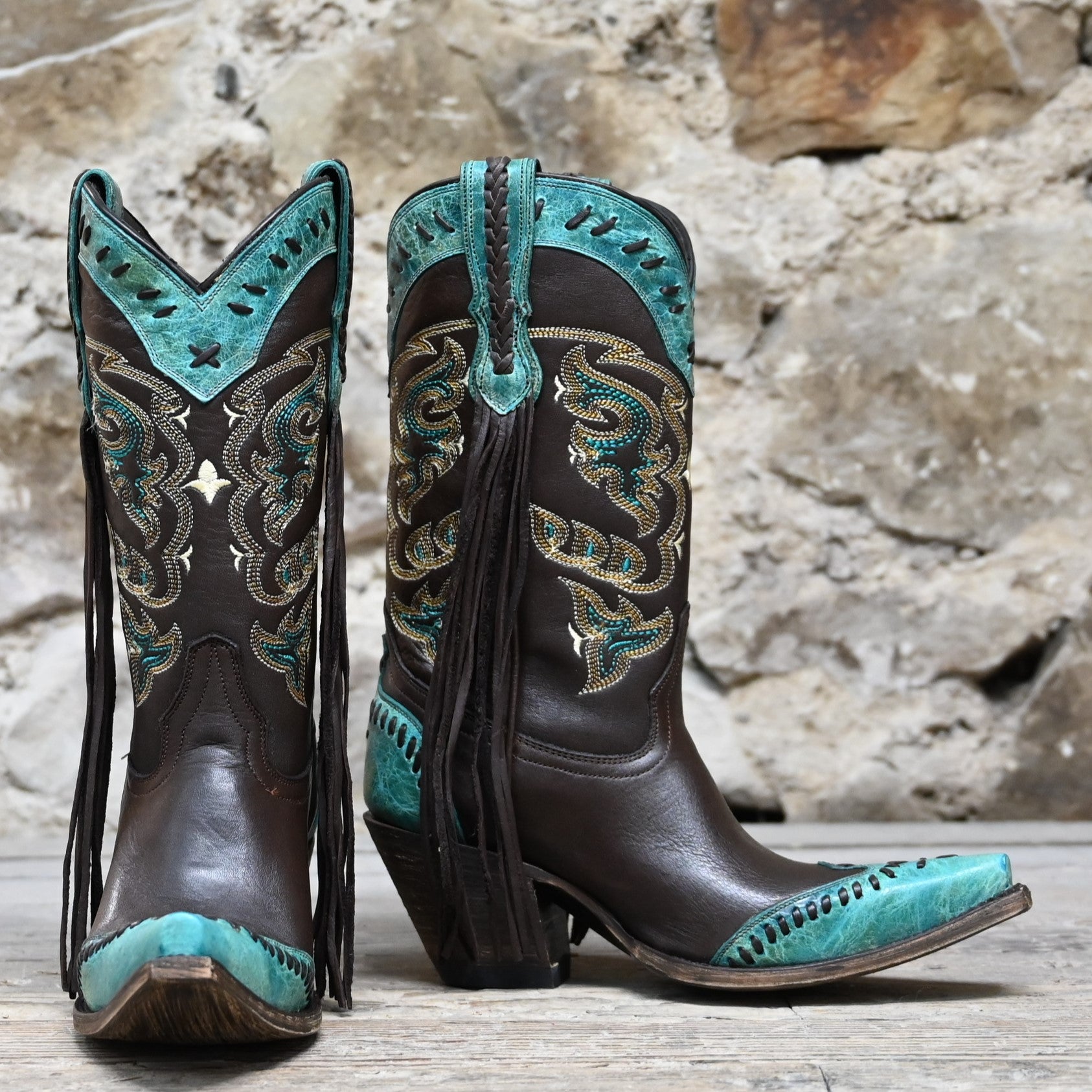 View of Lucchese ladies 11″ boot in chocolate leather with powder blue toe and collar, buckstitch trim, and tassel