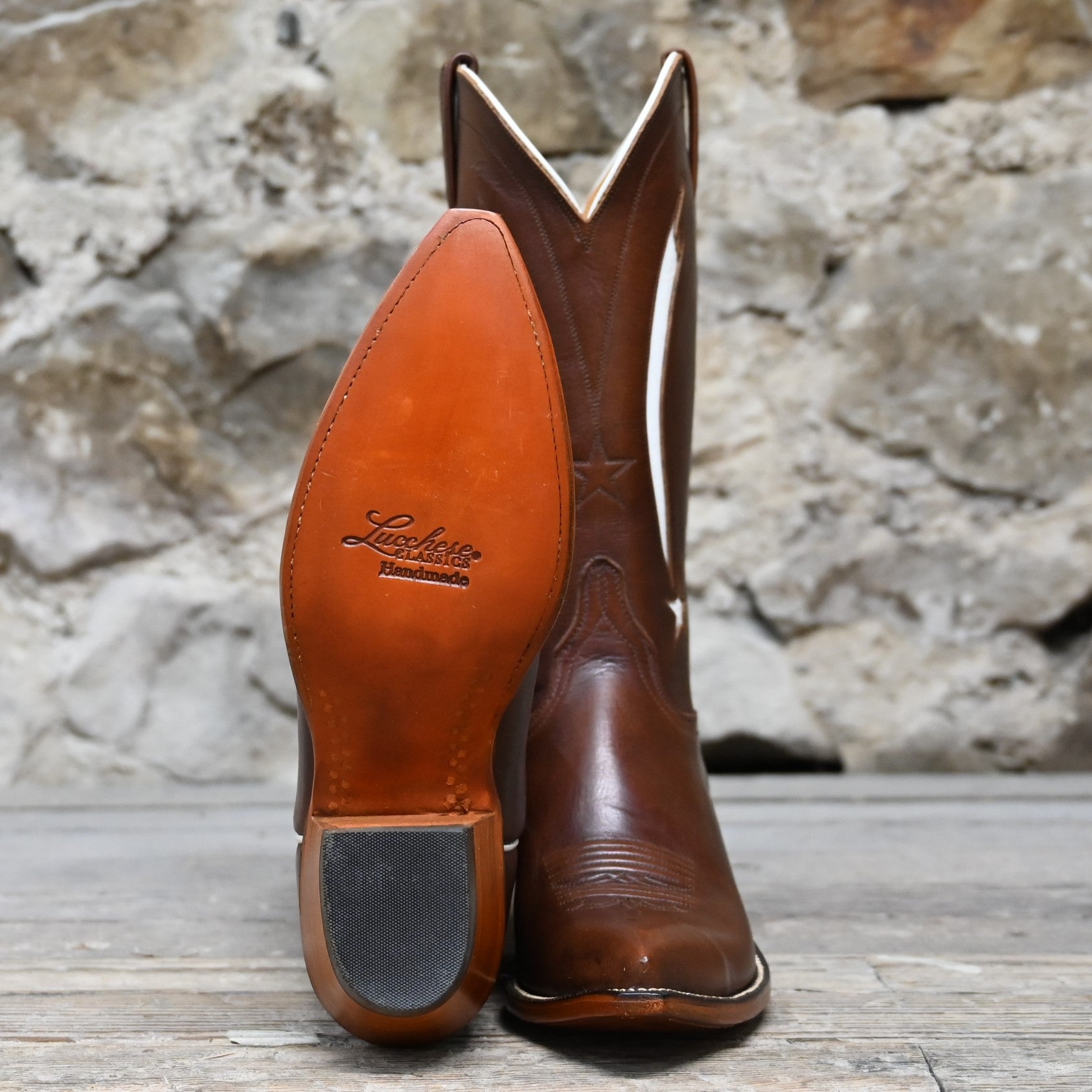 View of Lucchese ladies 12″ honey leather boot with star inlay and pointed square toe