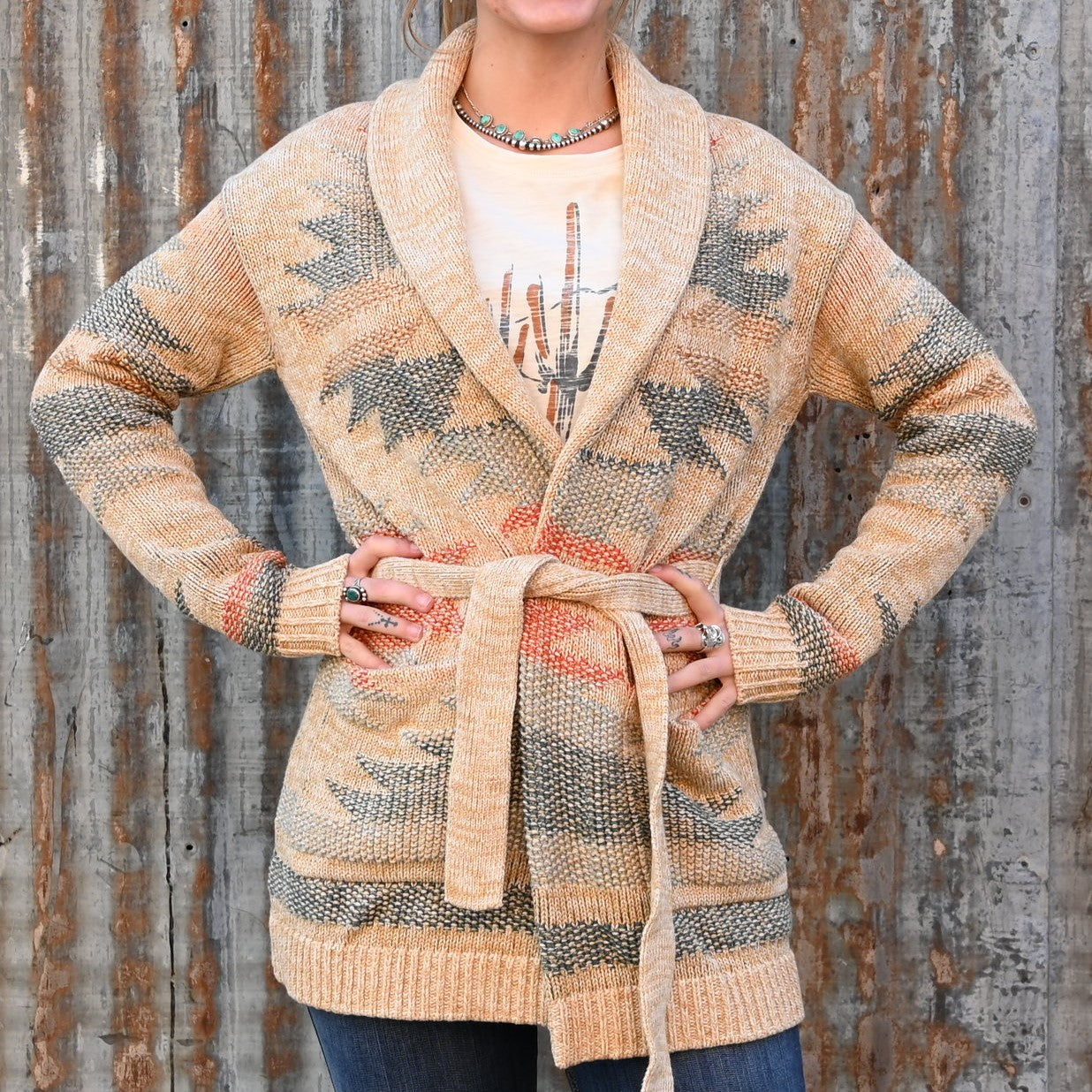 View of Pendleton ladies ivory and natural multi belted cotton cardigan with shawl collar