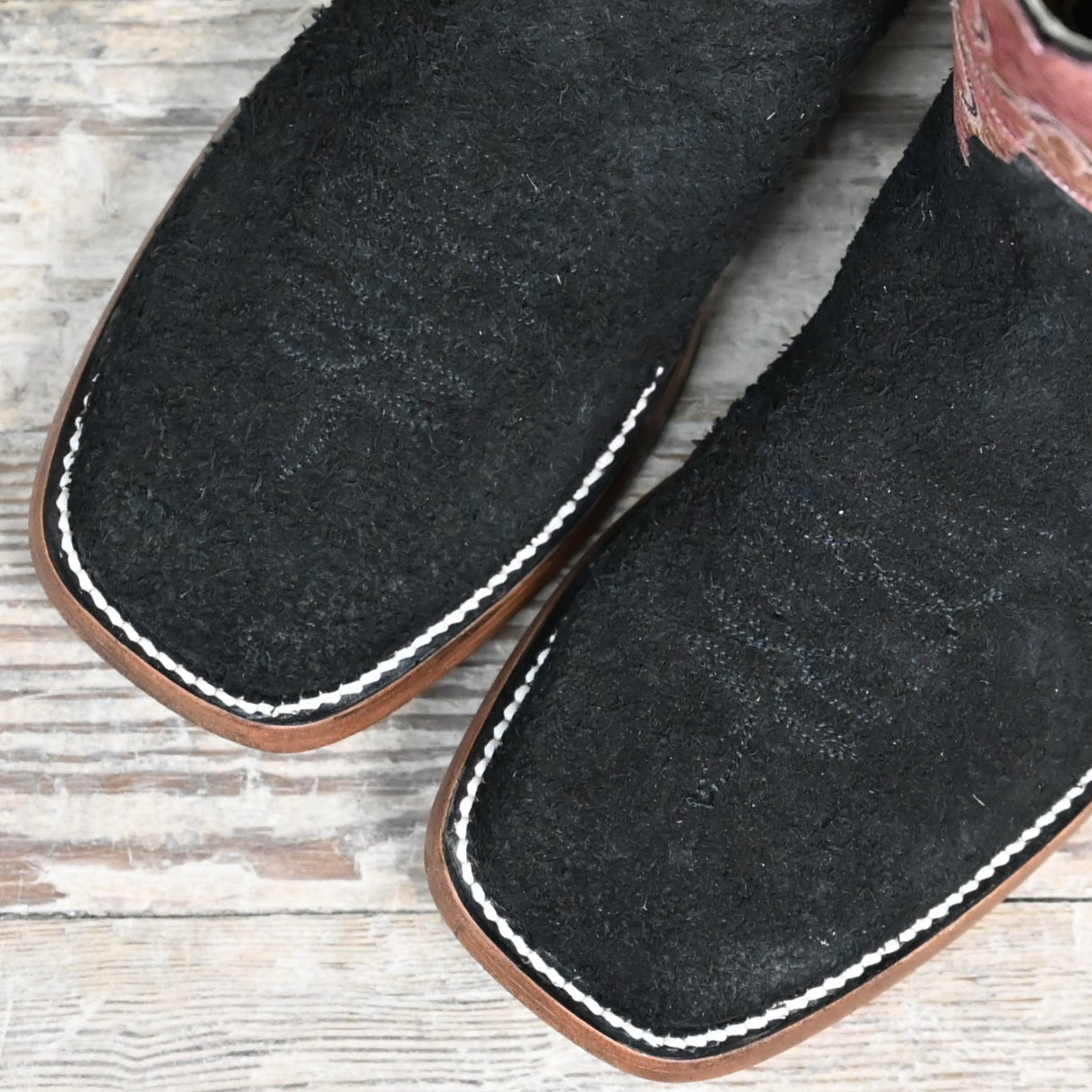 View of Hondo 11" cowboy boot with red crater top, black roughout vamp, wide square toe, and pull holes