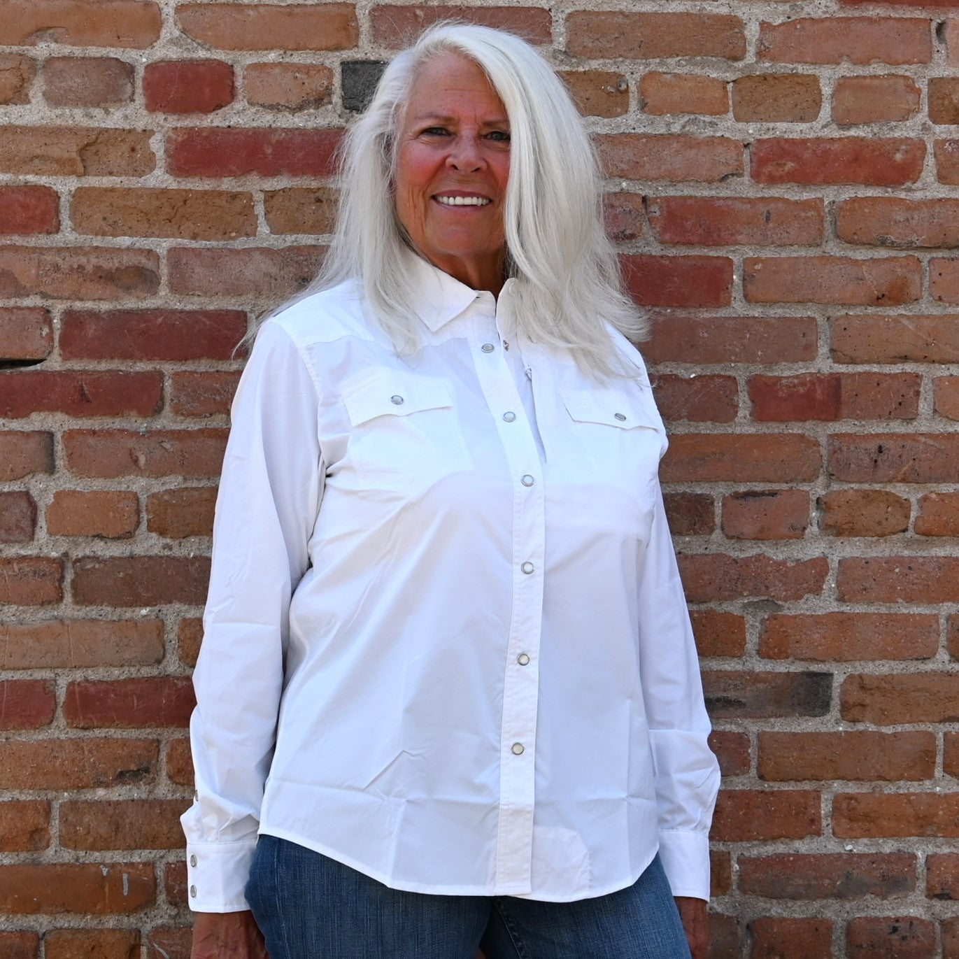 View of Schaefer white Range Tek shirt with snap front, mesh back vent, and functional chest pockets