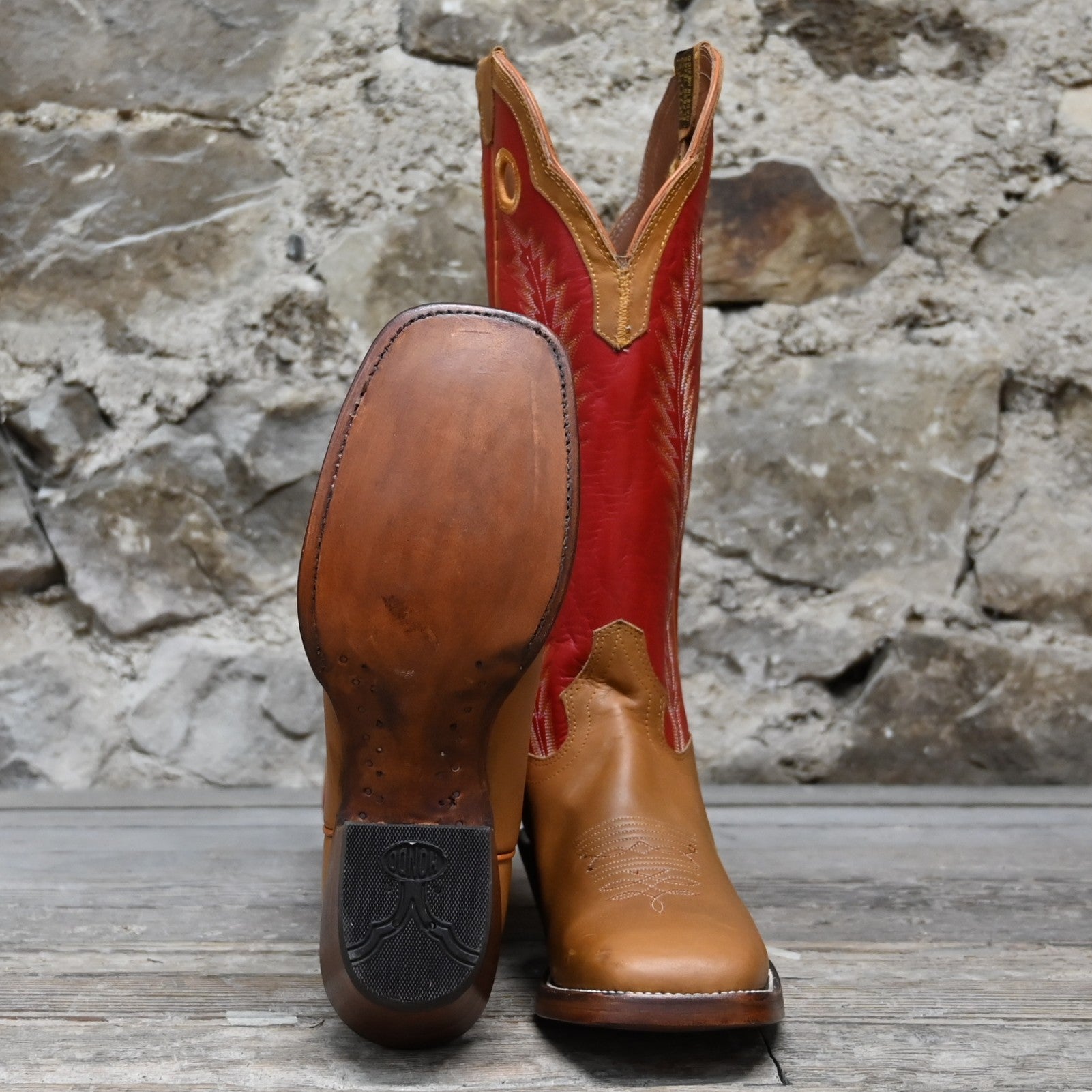 View of Hondo 16" cowboy boot with red top, honey crazy horse vamp, wide square toe, pull holes, and spur ledge