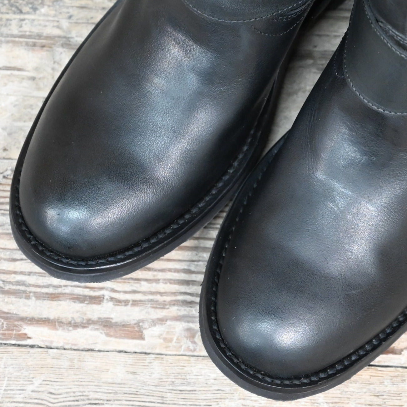 View of Hondo 12" black leather boot with wide round toe, rugged profile,