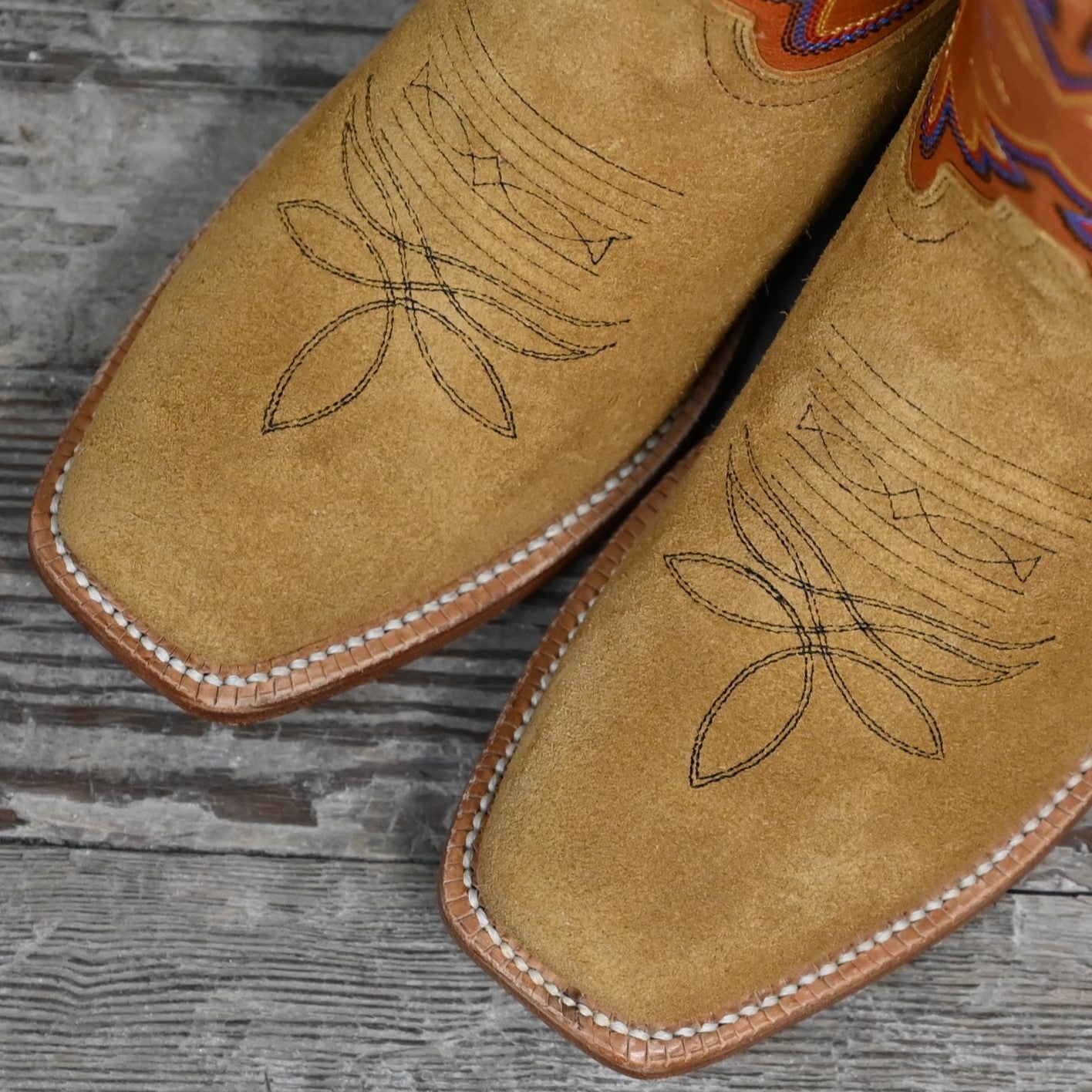 View of Hyer ROSE HILL 13" boots showcasing tangerine vintage goat top and bronze napped roughout cowhide vamp with Cutter toe and leather stacked heel