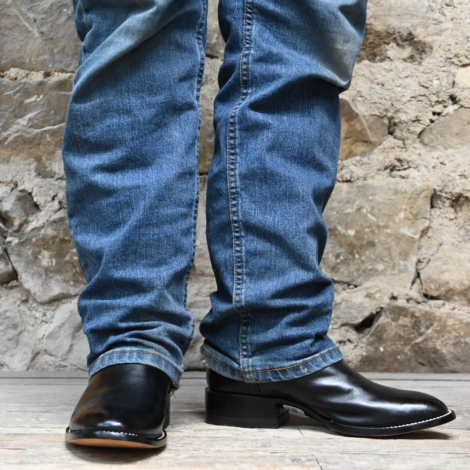 View of Hondo black cowboy boot with medium round toe, 11" top, and pull straps
