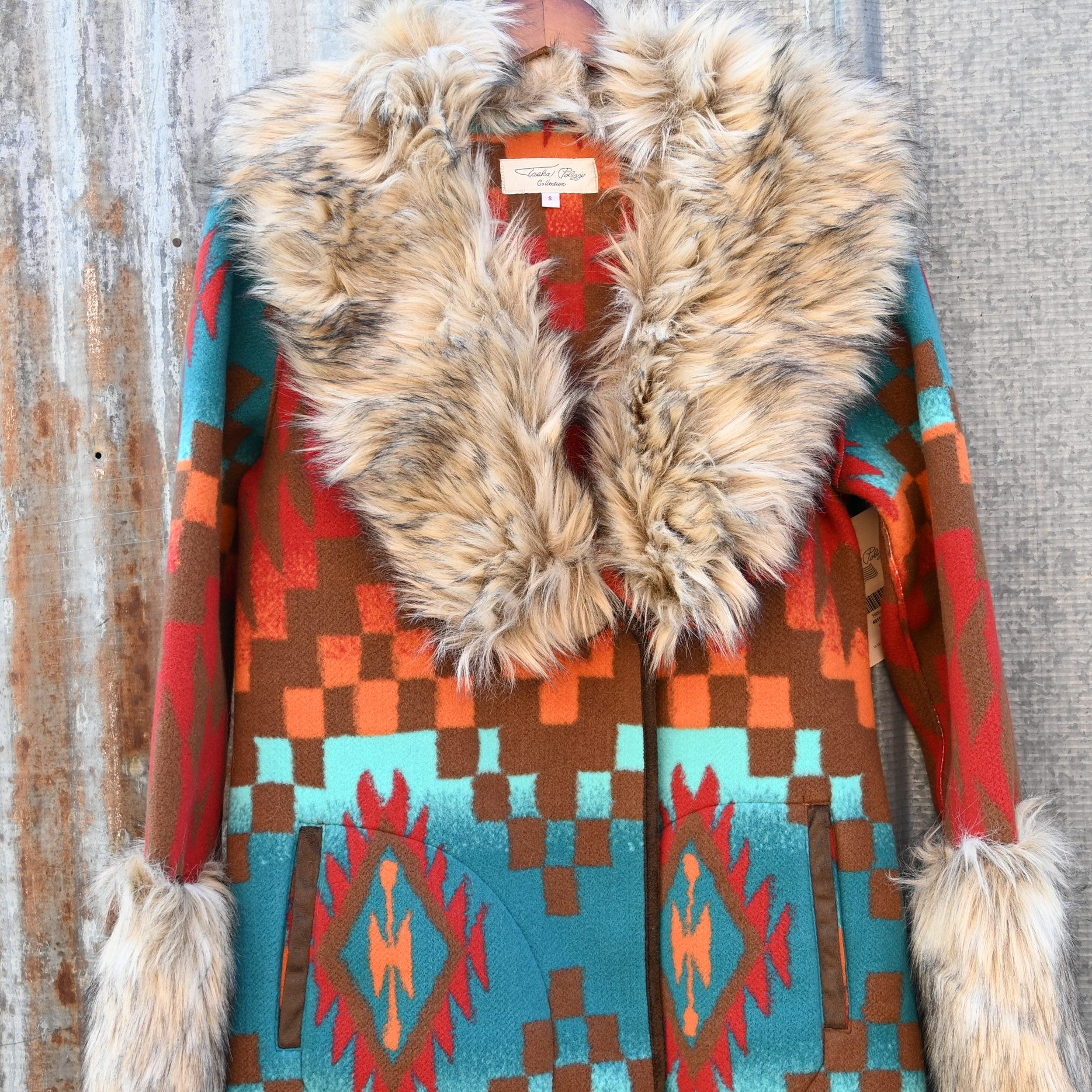 Tasha Polizzi Casey Coat in geometric orange, red, turquoise, and brown wool with removable faux fur collar and cuffs