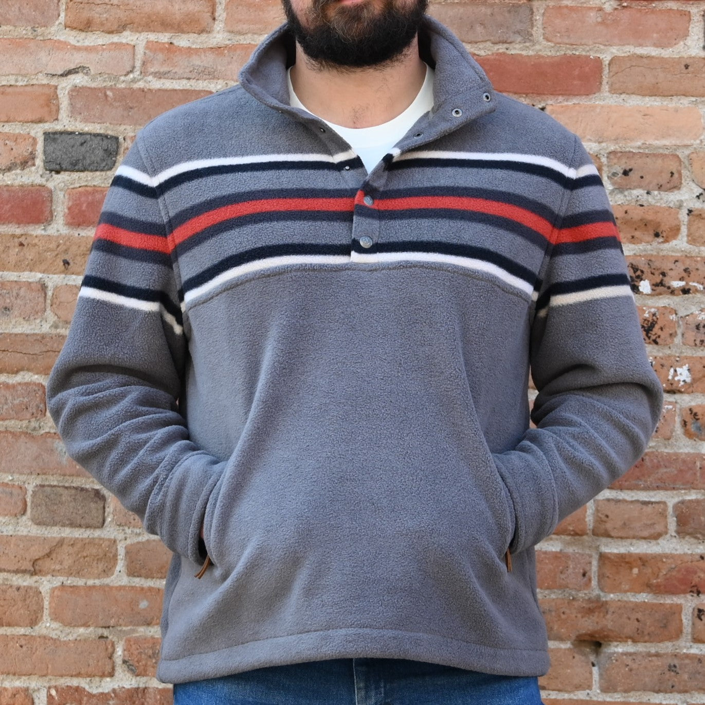 View of Schaefer Teton pullover fleece in Teton or Silverton color with storm collar and zip waist pockets