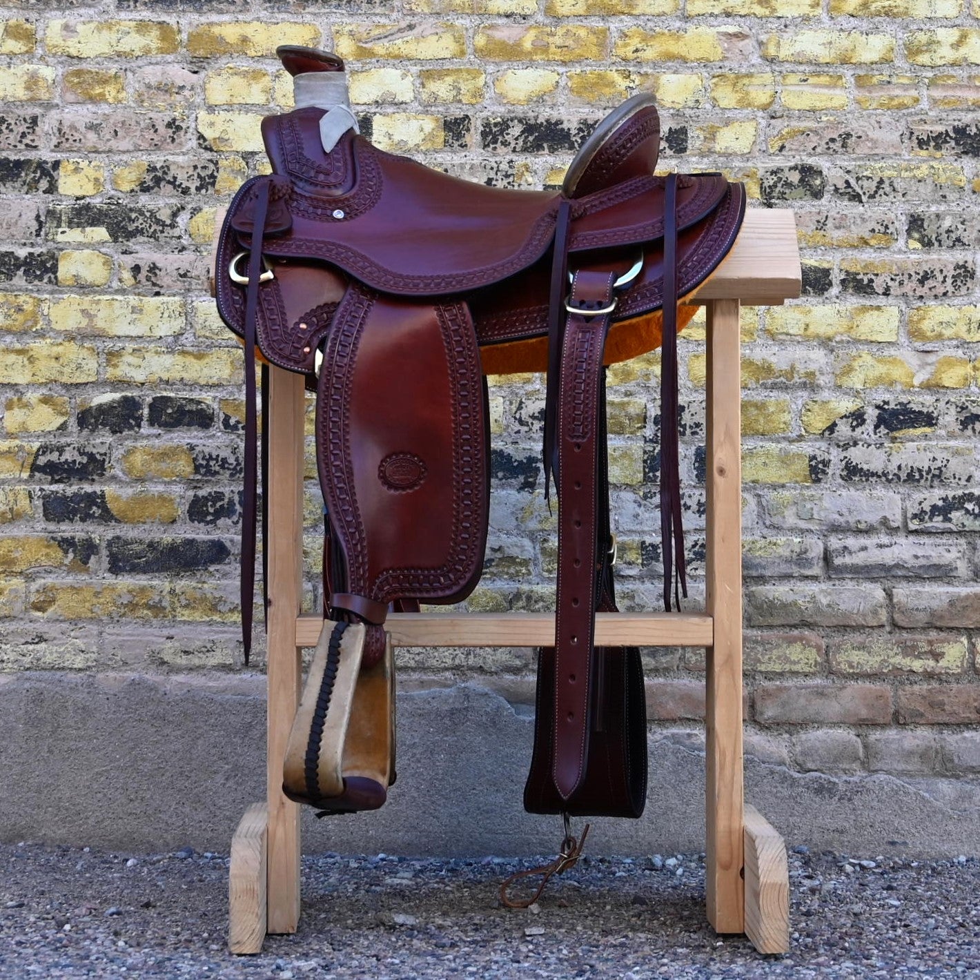 View of Billy Cook 15½" Arbuckle Wade Saddle with waffle border tooling and 7/8 in-skirt rigging