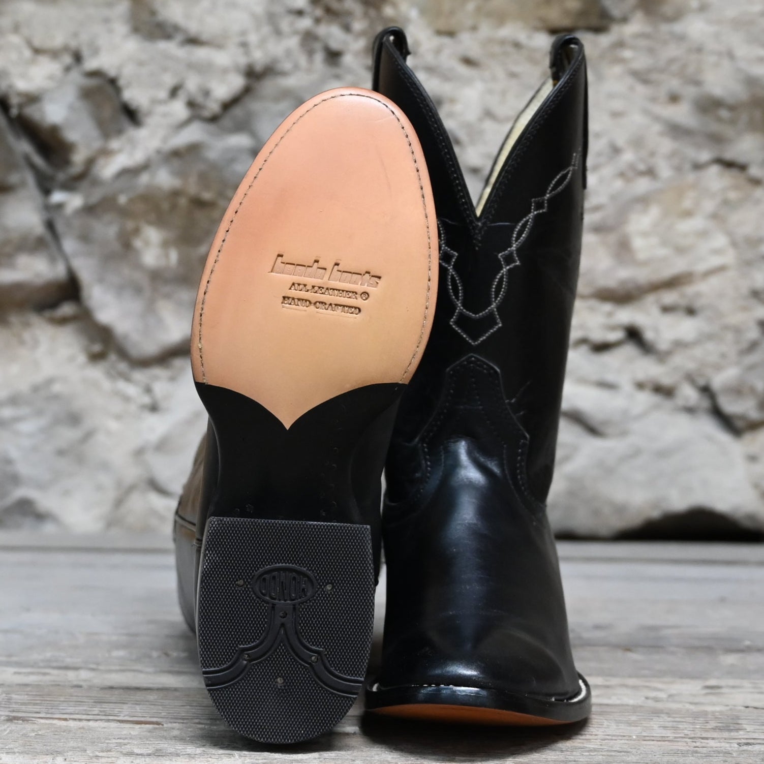 View of Hondo black cowboy boot with medium round toe, 11" top, and pull straps