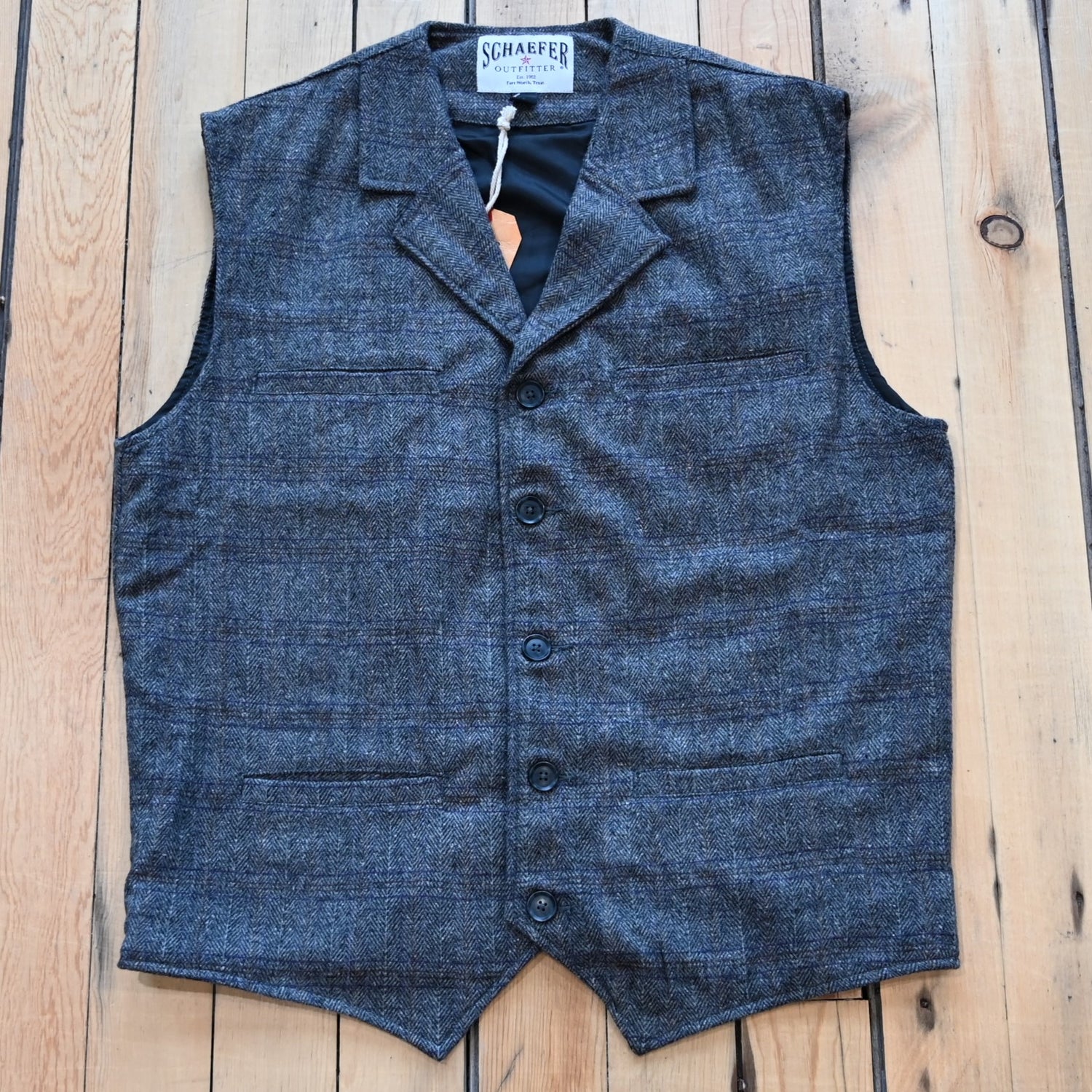 View of Schaefer Laramie vest in assorted wool-blend patterns with Western lapels and four-pocket design
