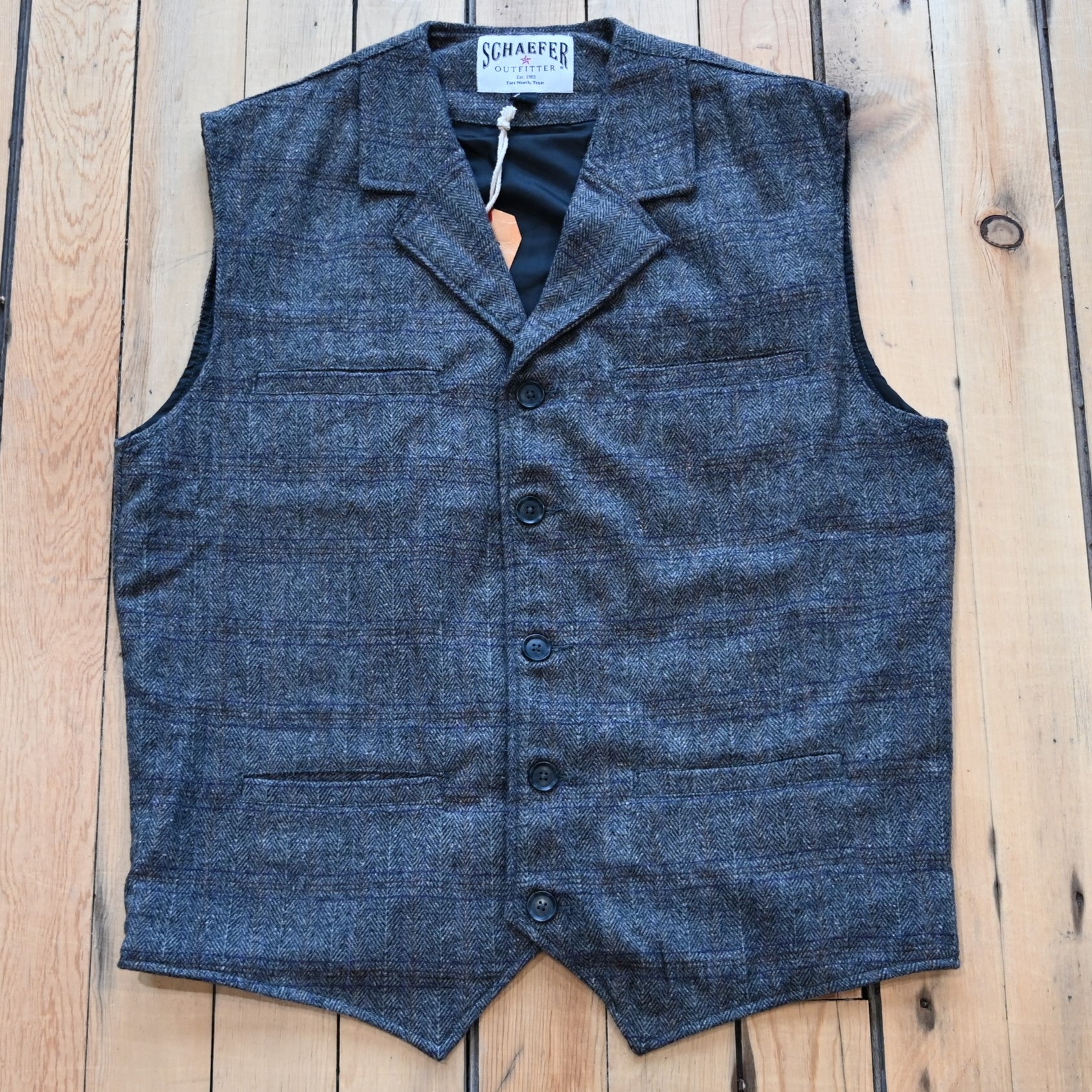 View of Schaefer Laramie vest in assorted wool-blend patterns with Western lapels and four-pocket design