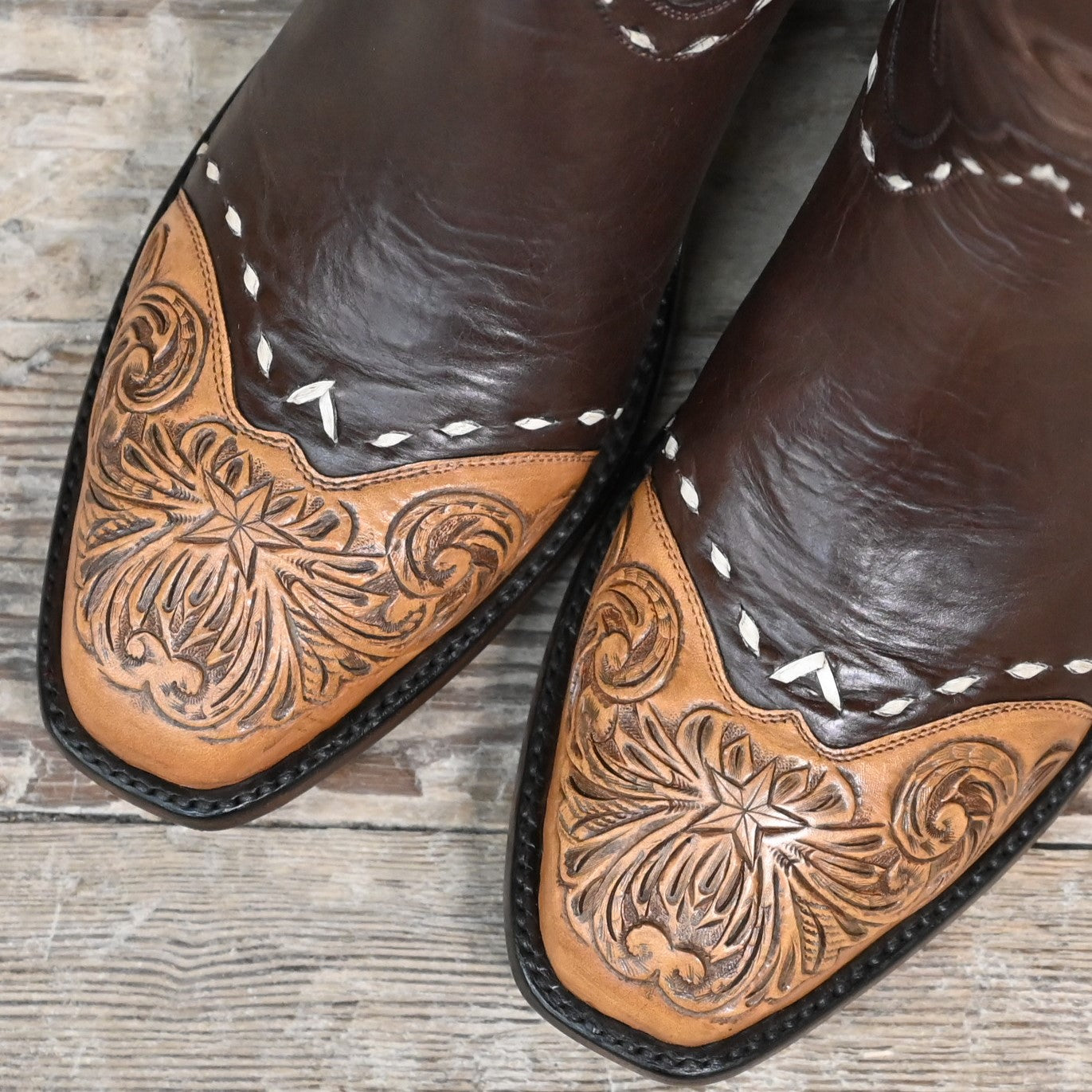 View of Stallion Ladies 14" chocolate cowhide boot with floral tooled top and bone buckstitching