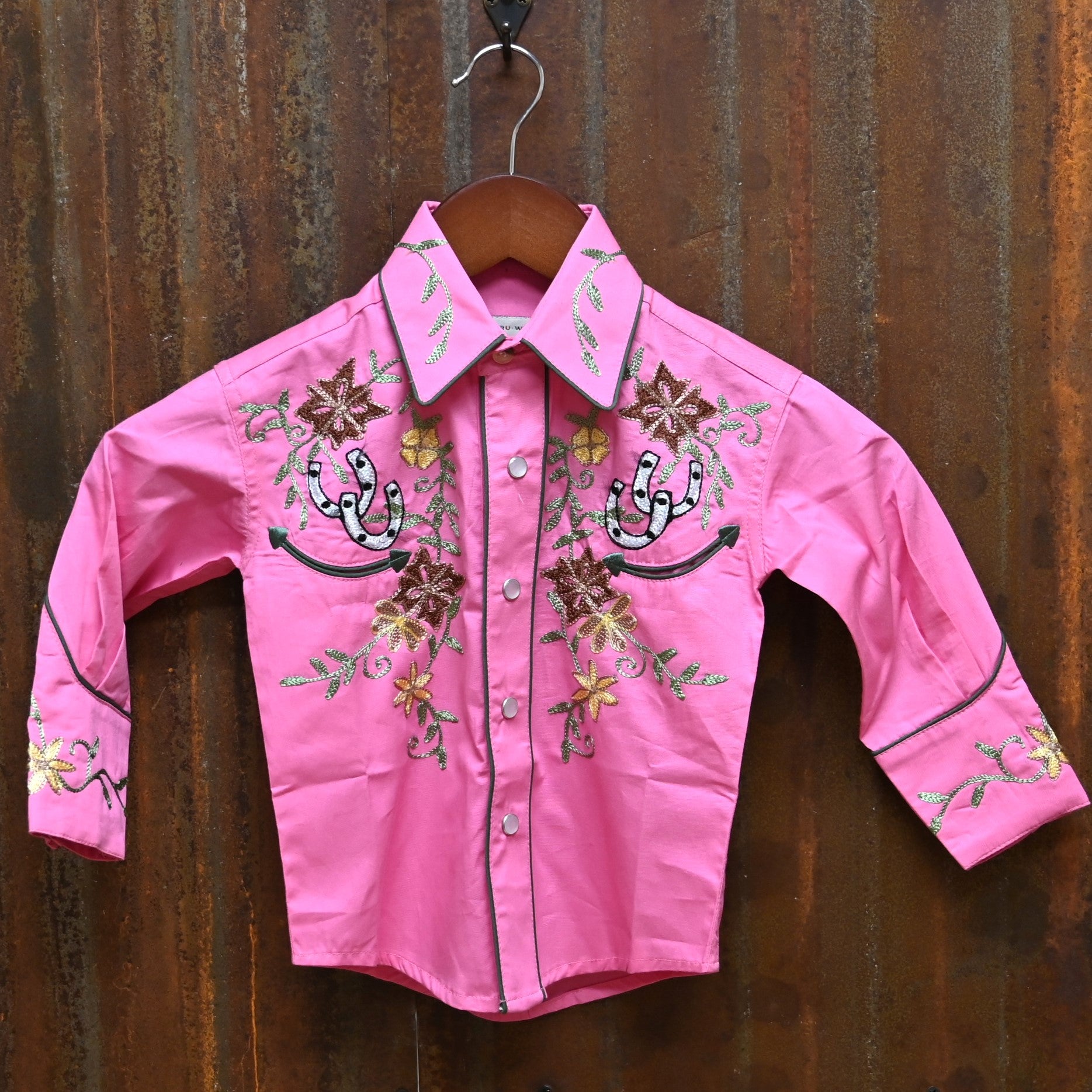 View of Pink Rockmount kids western shirt with embroidered flowers and horseshoes