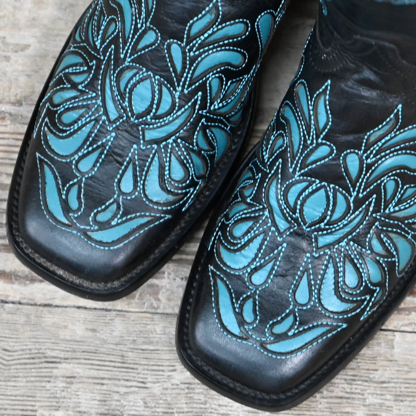 View of Hondo 13" black volcano cowboy boot with turquoise inlays and wide square toe