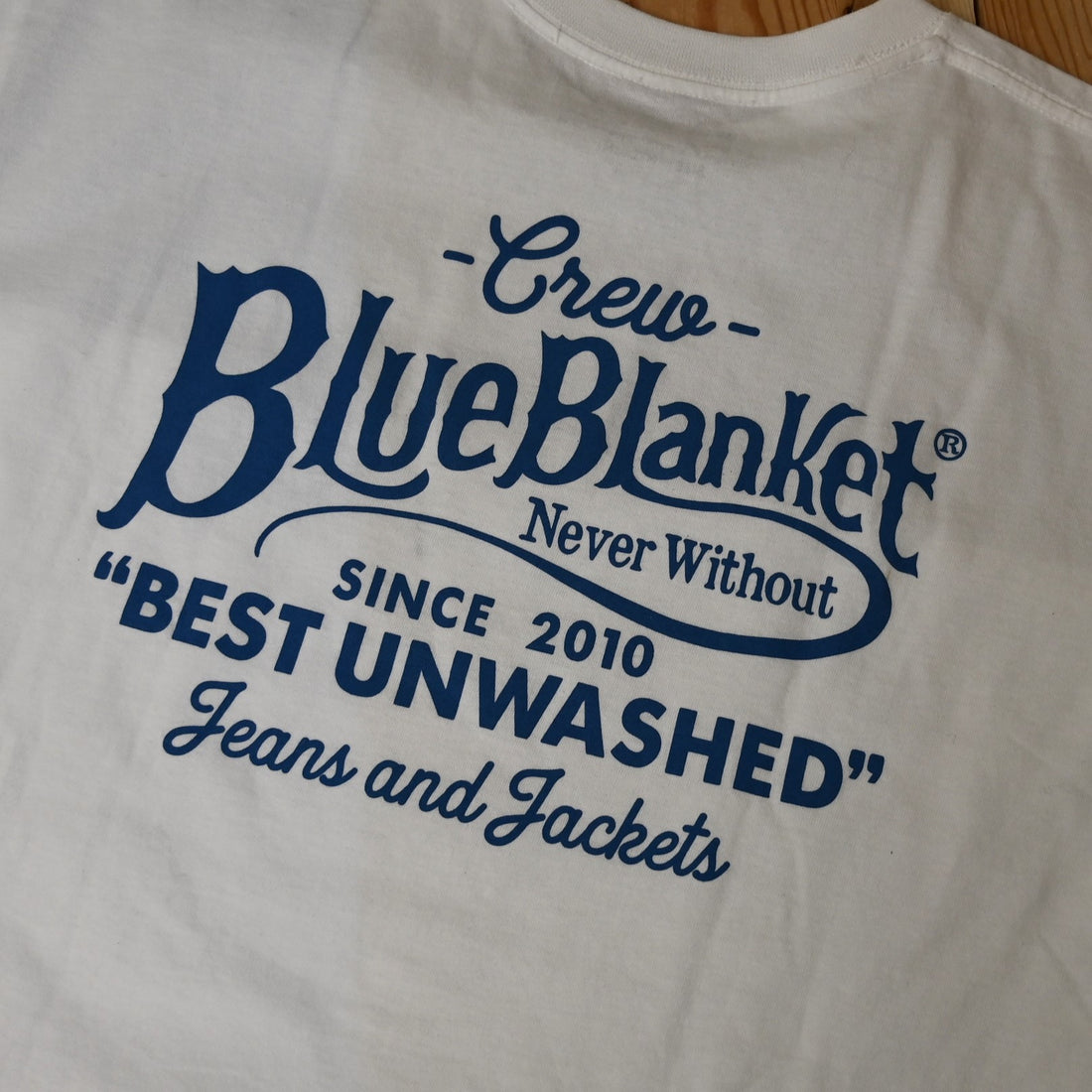 View of Blue Blanket men’s white crew-neck t-shirt with contrasting logo print