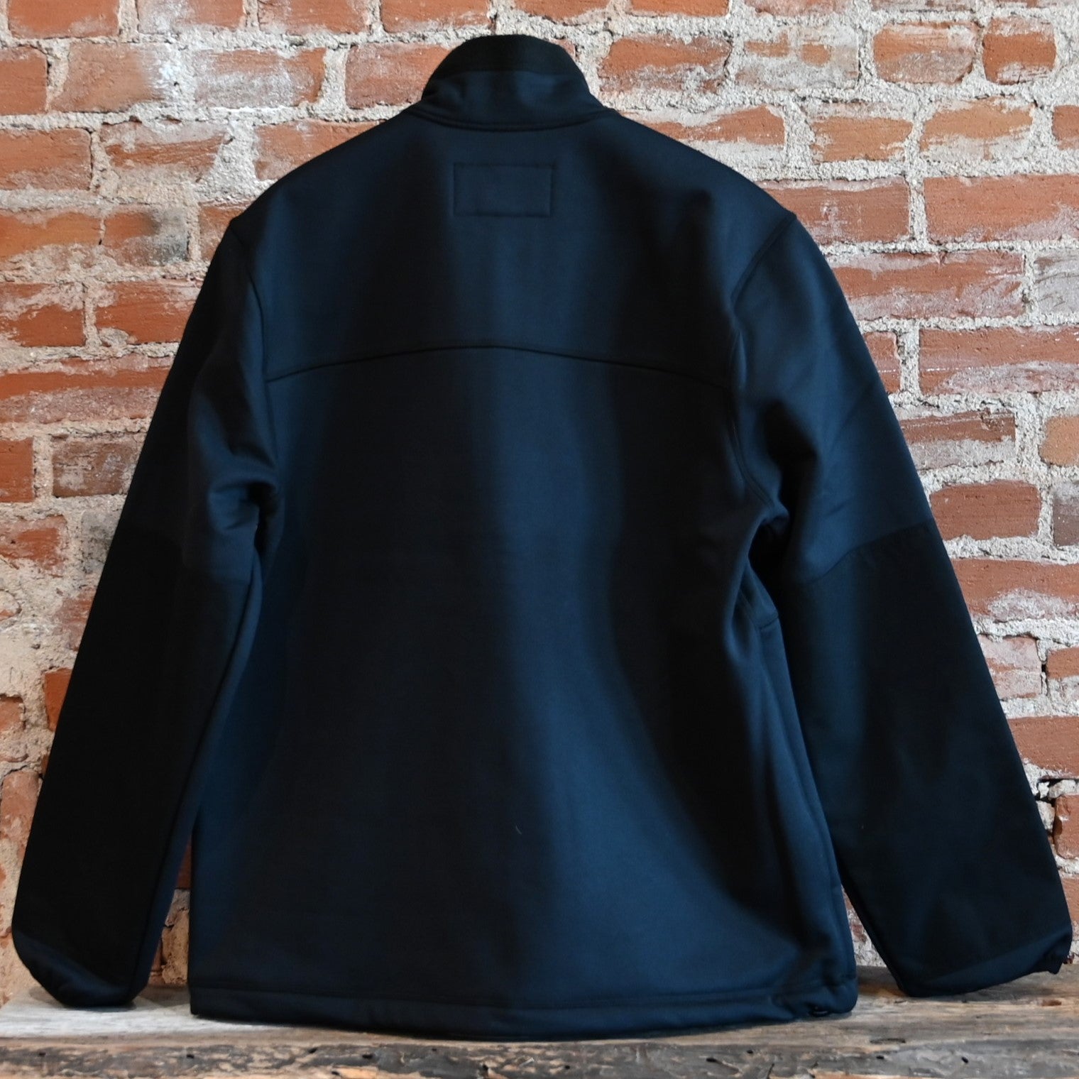 View of Filson Granite Spire Fleece Jacket featuring Cordura® nylon-reinforced forearms and microfleece-lined handwarmer pockets