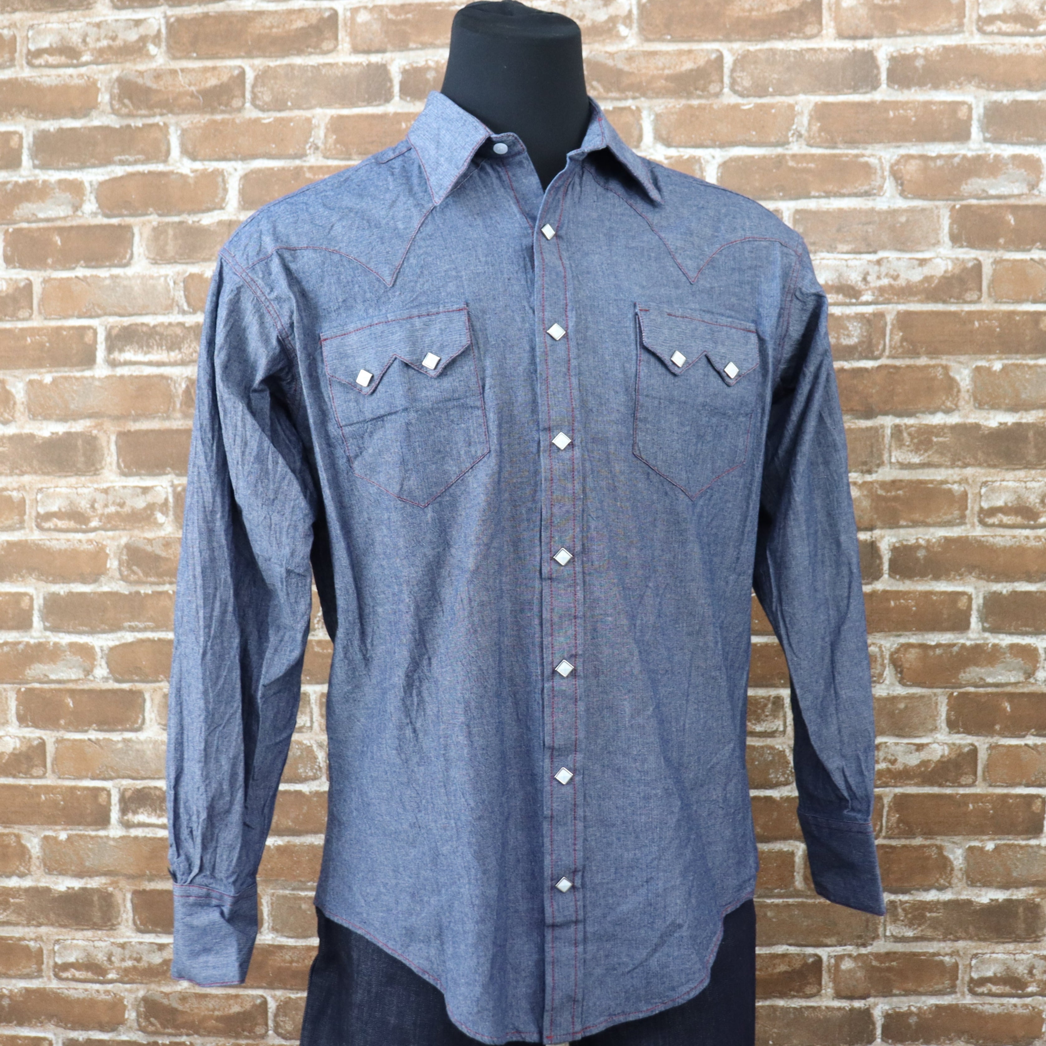View of Rockmount blue chambray western shirt with sawtooth pockets and diamond snaps