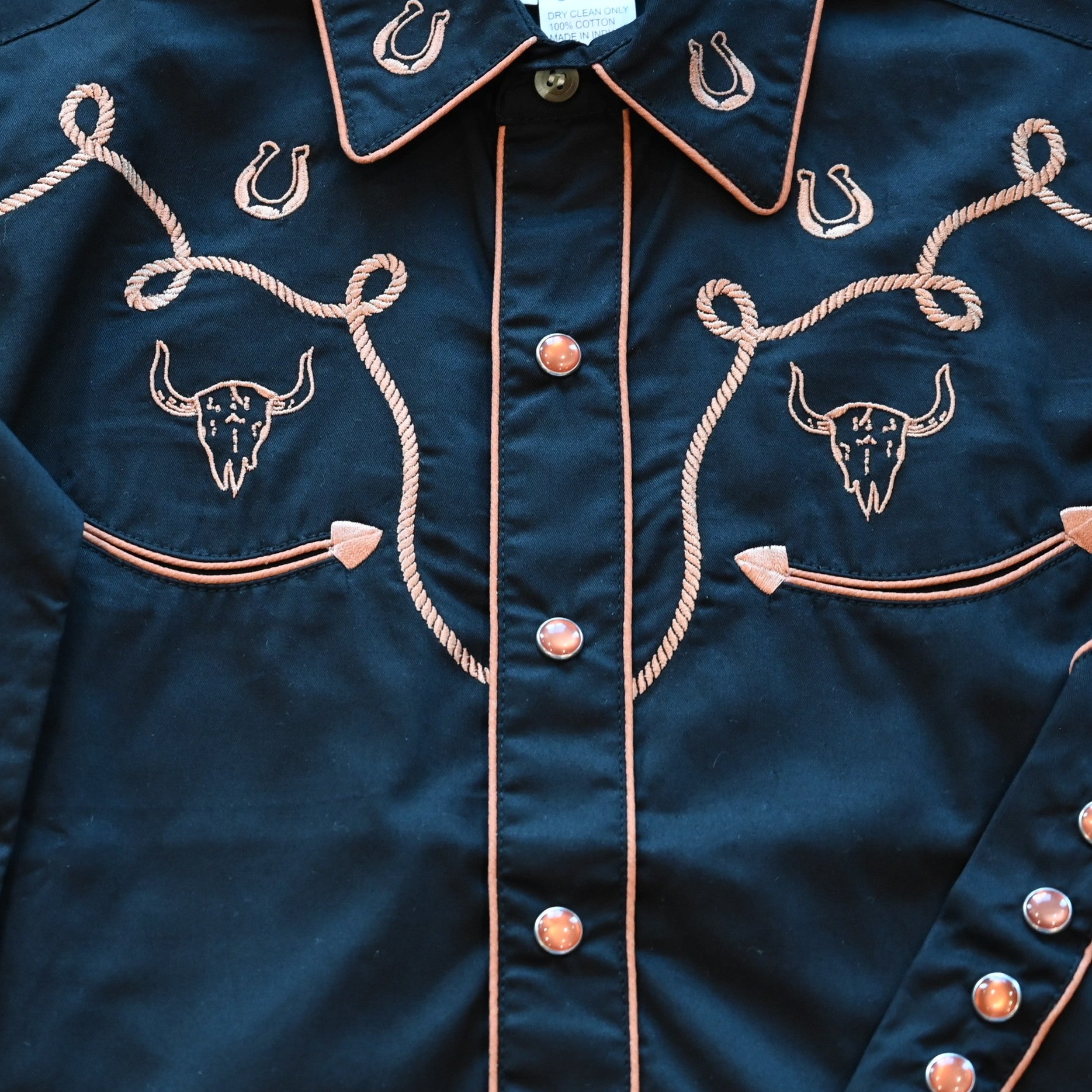 View of Rockmount Kids black western shirt with steer, horseshoe, and rope embroidery