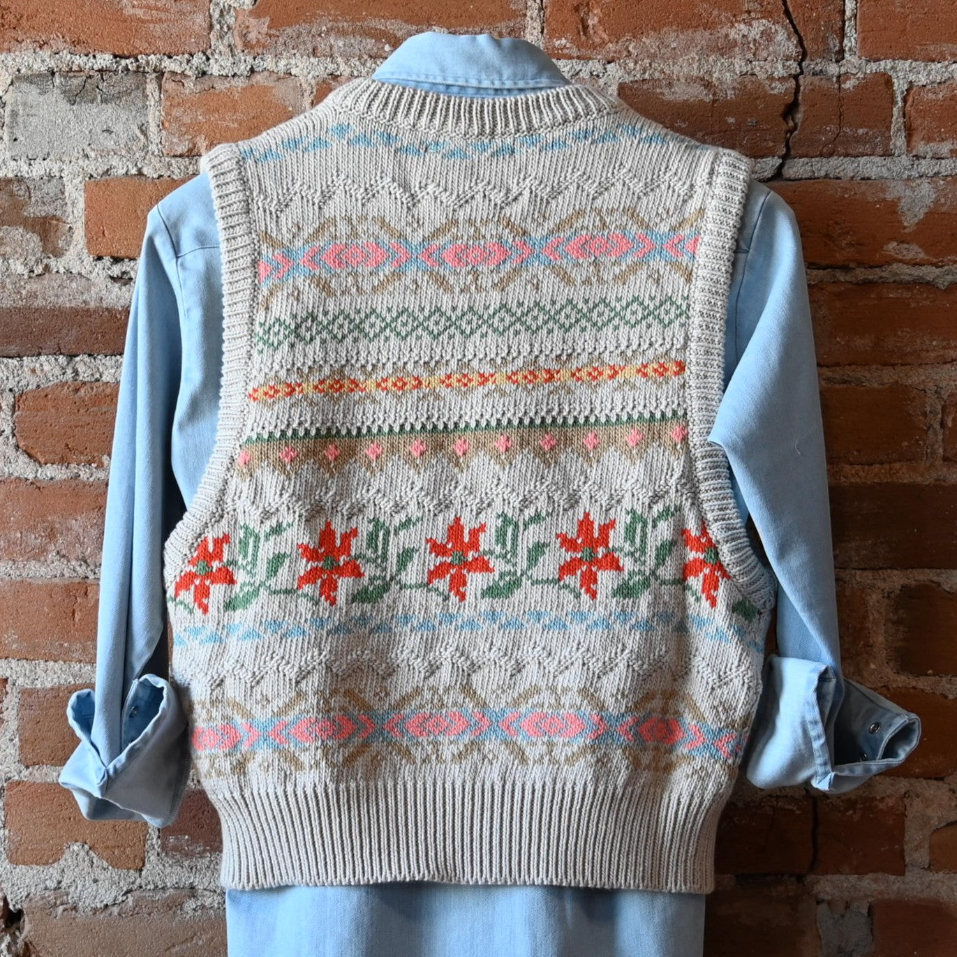 View of Filson Ladies 3GG Jacquard Fairisle Flower Vest featuring a floral jacquard-knit pattern and rib-knit collar