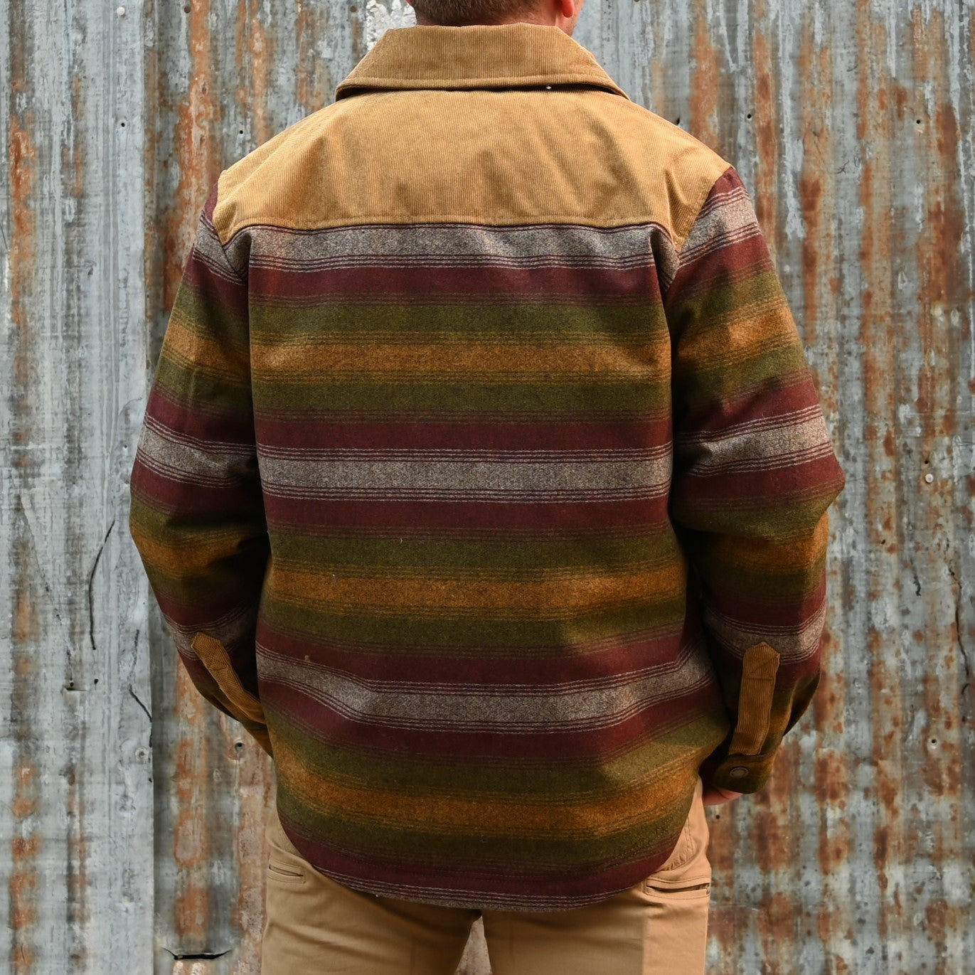 View of Pendleton men’s Timberline shirt jacket in olive bronze ombre stripe with quilted lining and corduroy yoke
