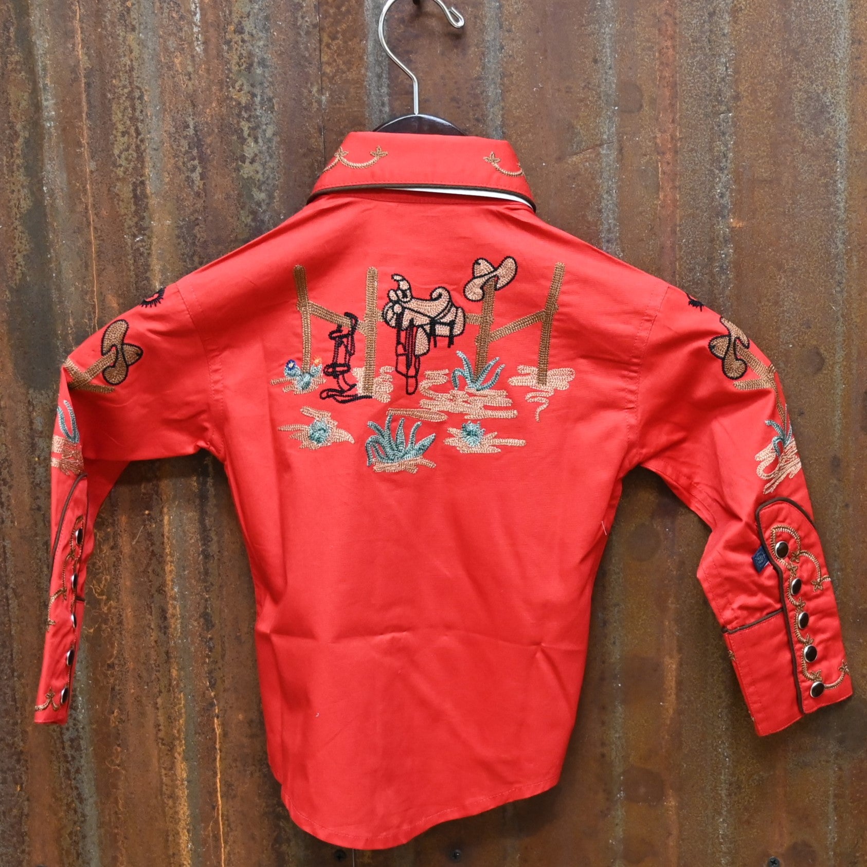 View of Red Rockmount kids western shirt with cactus and boot embroidery and Western piping