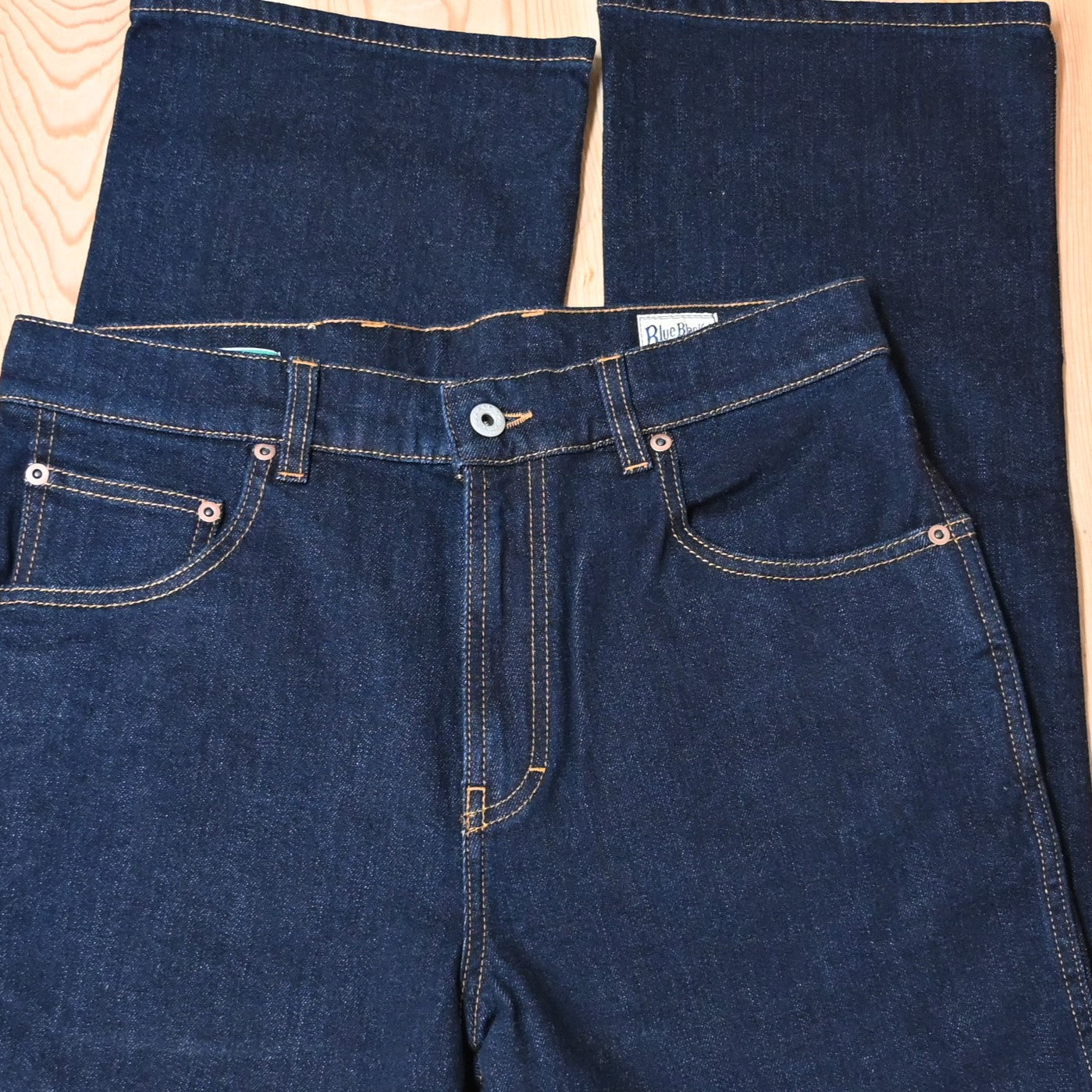 View of Blue Blanket men’s dark indigo denim jeans with straight-leg fit and leather patch